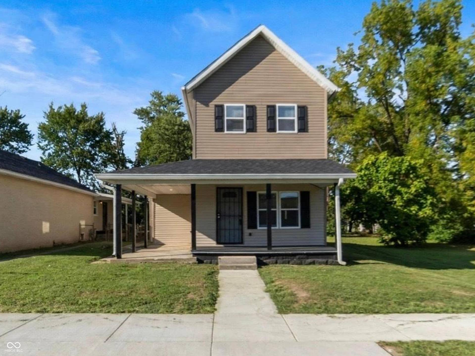 Two-story residence with siding exterior