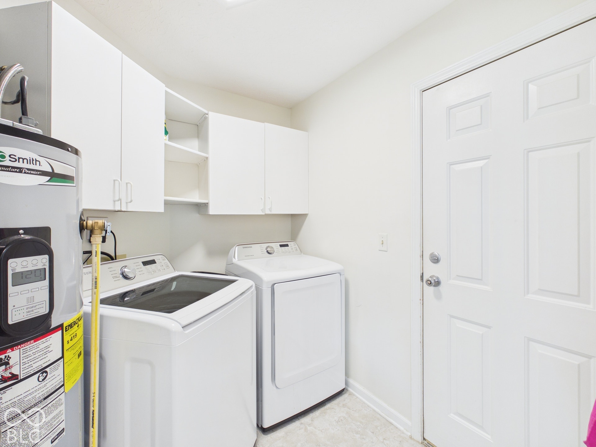 White shaker-style cabinetry with open shelving