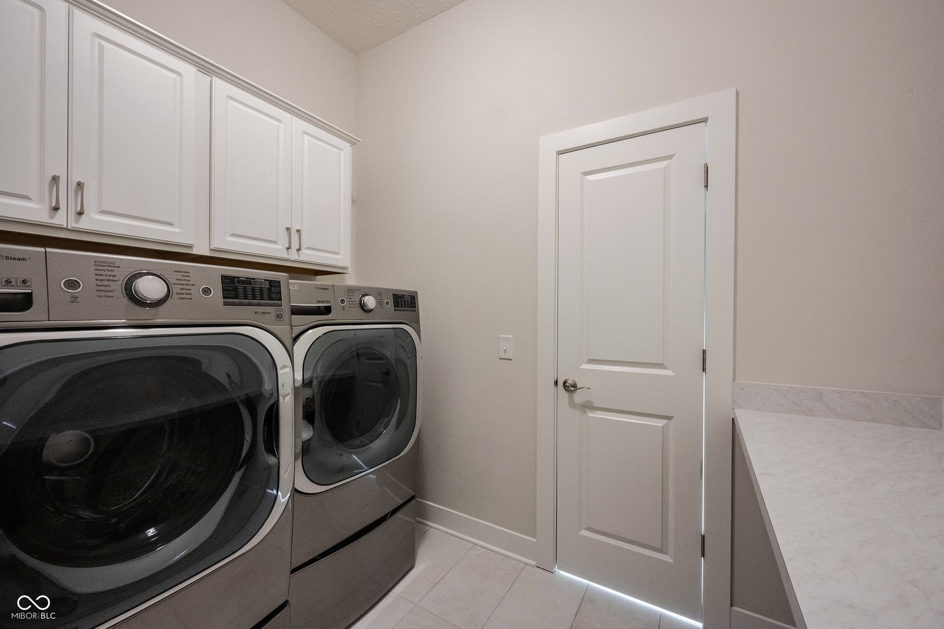 Another view of the laundry room showing the folding station.