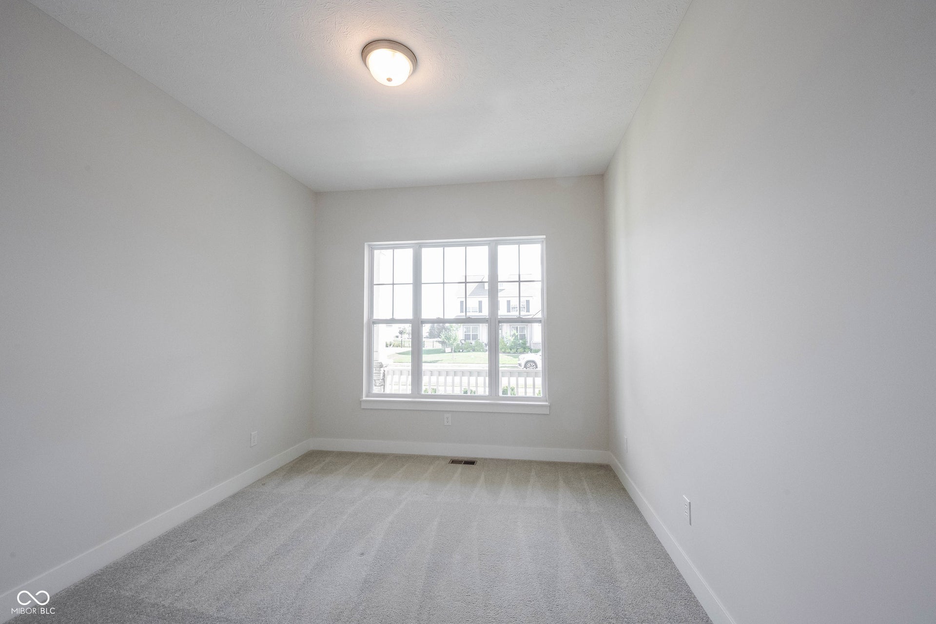 Same photo of the 2nd bedroom on the main level not staged.