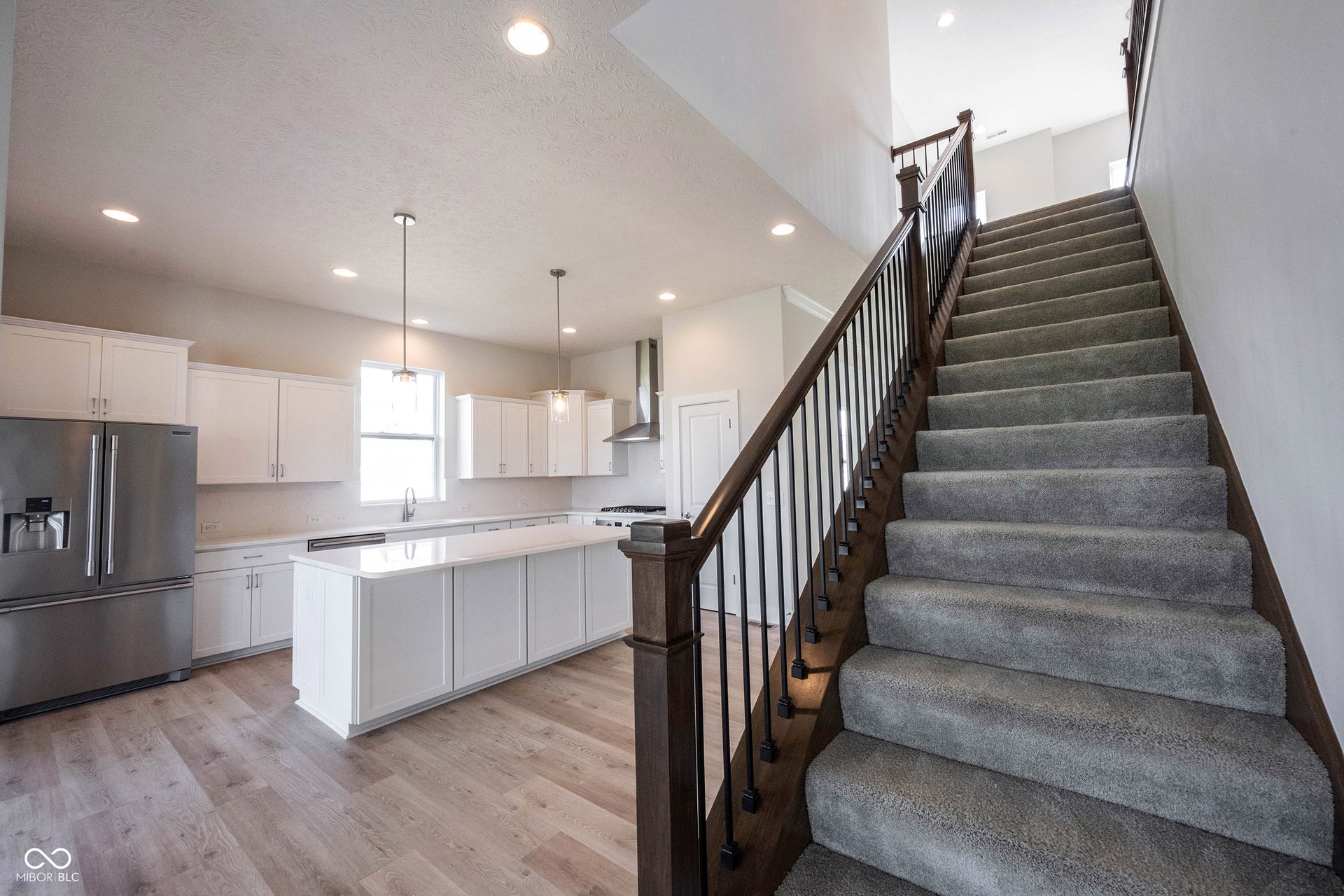 Staircase leading to the second floor where it meets the loft.