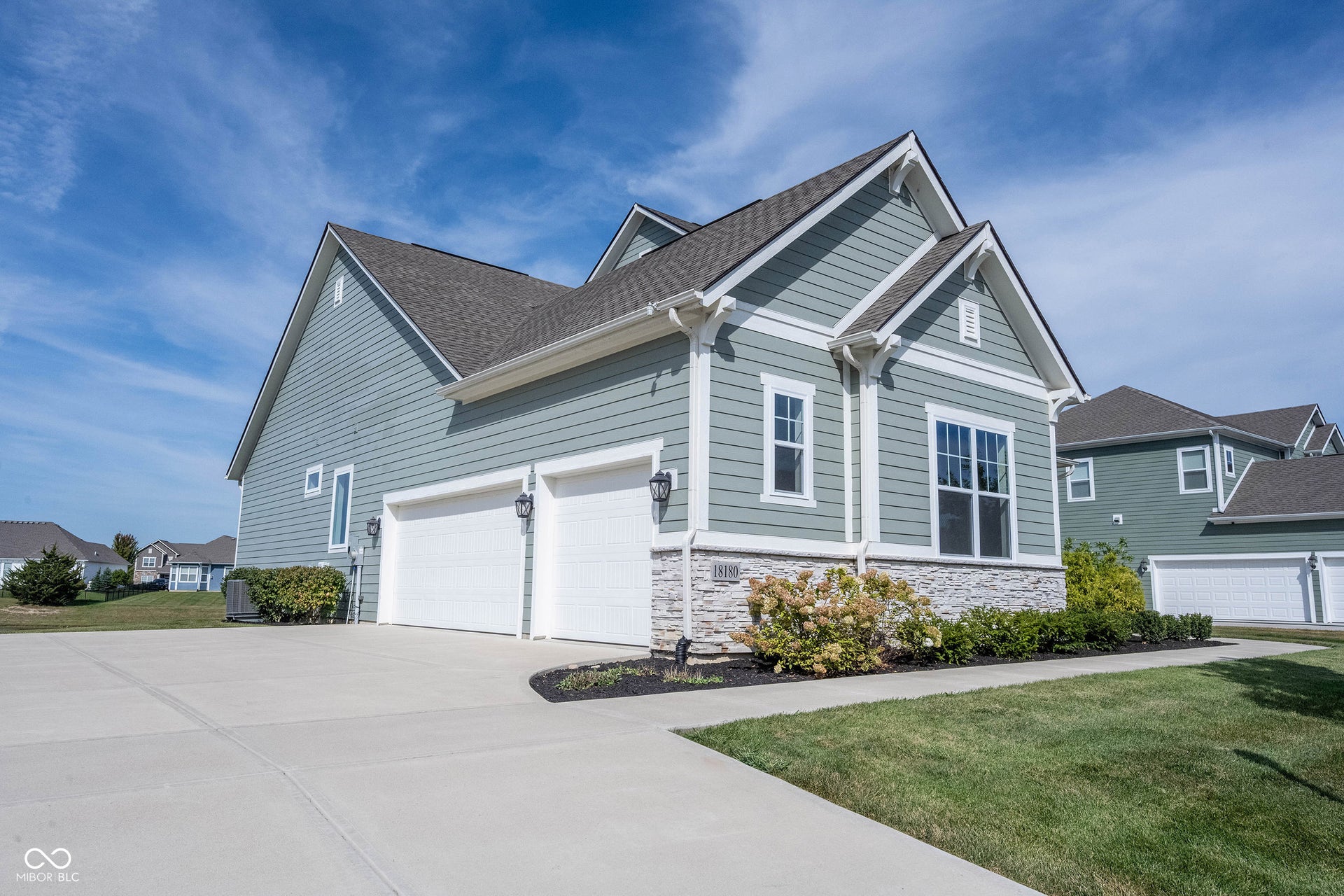 3 Car Side-load garage with long driveway.