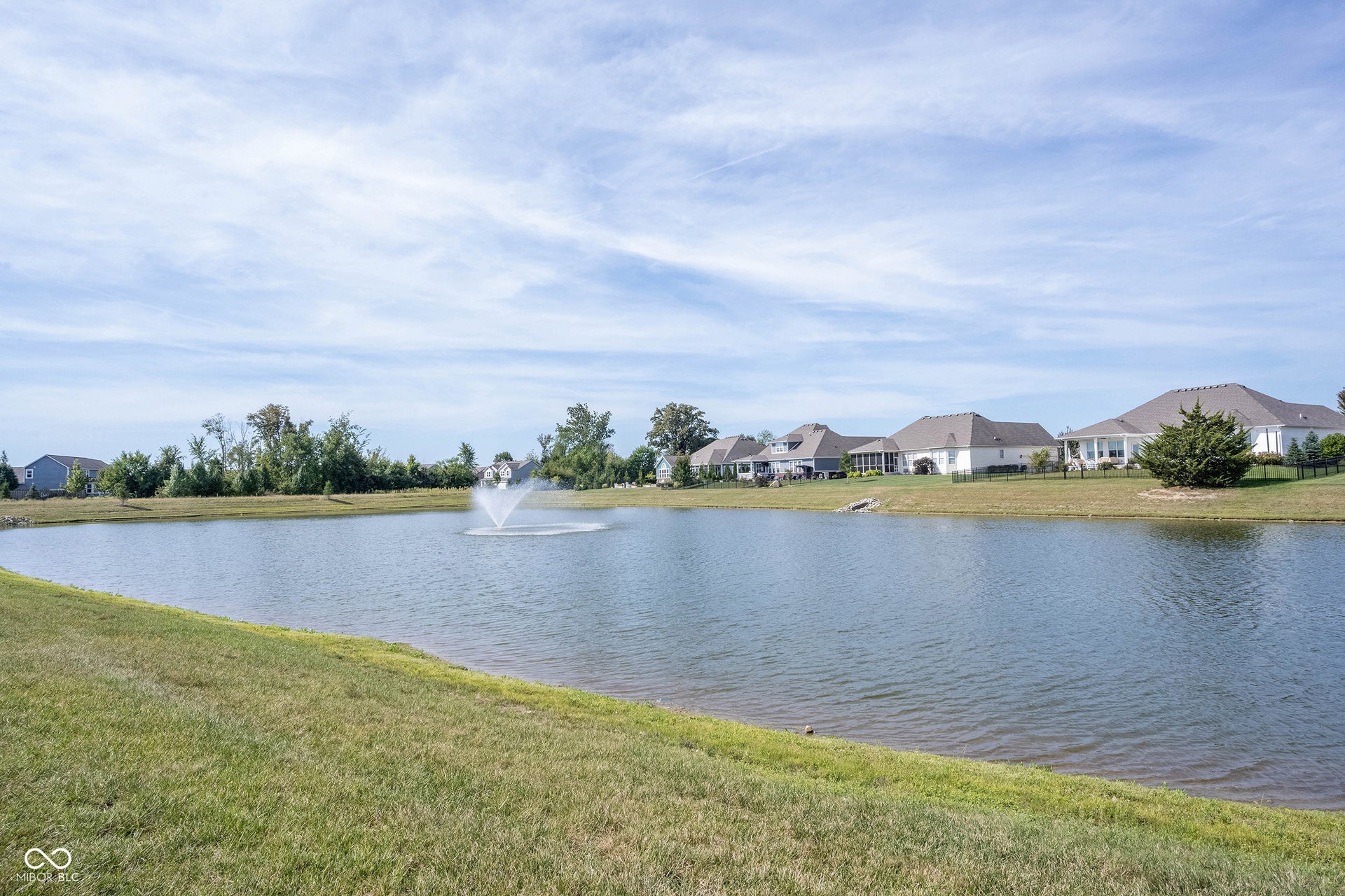 Pond view with fountain that can be seen from every back window of the home.