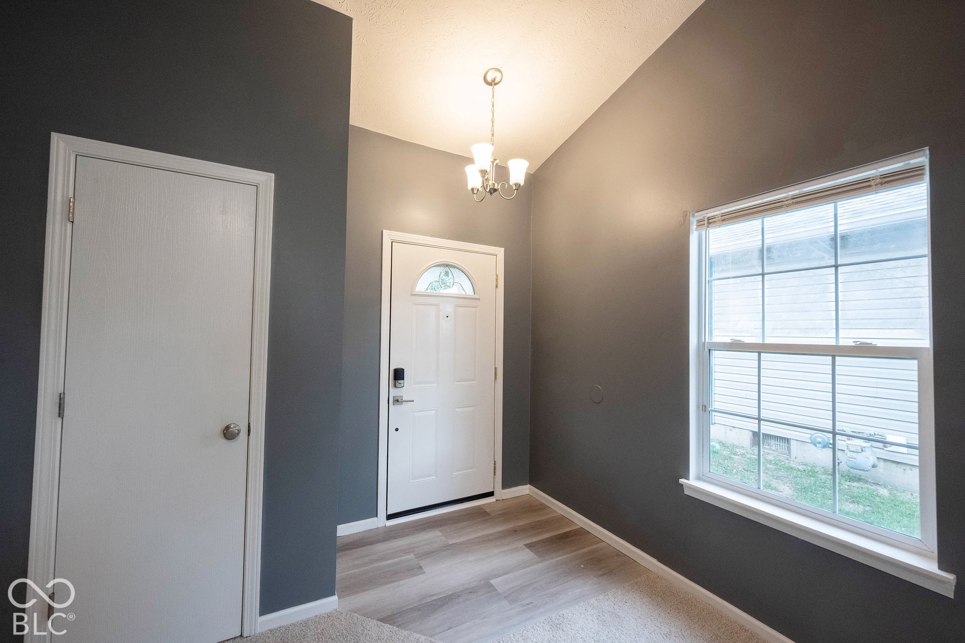 This home welcomes you immediately with wood-style floors and plenty of natural light!