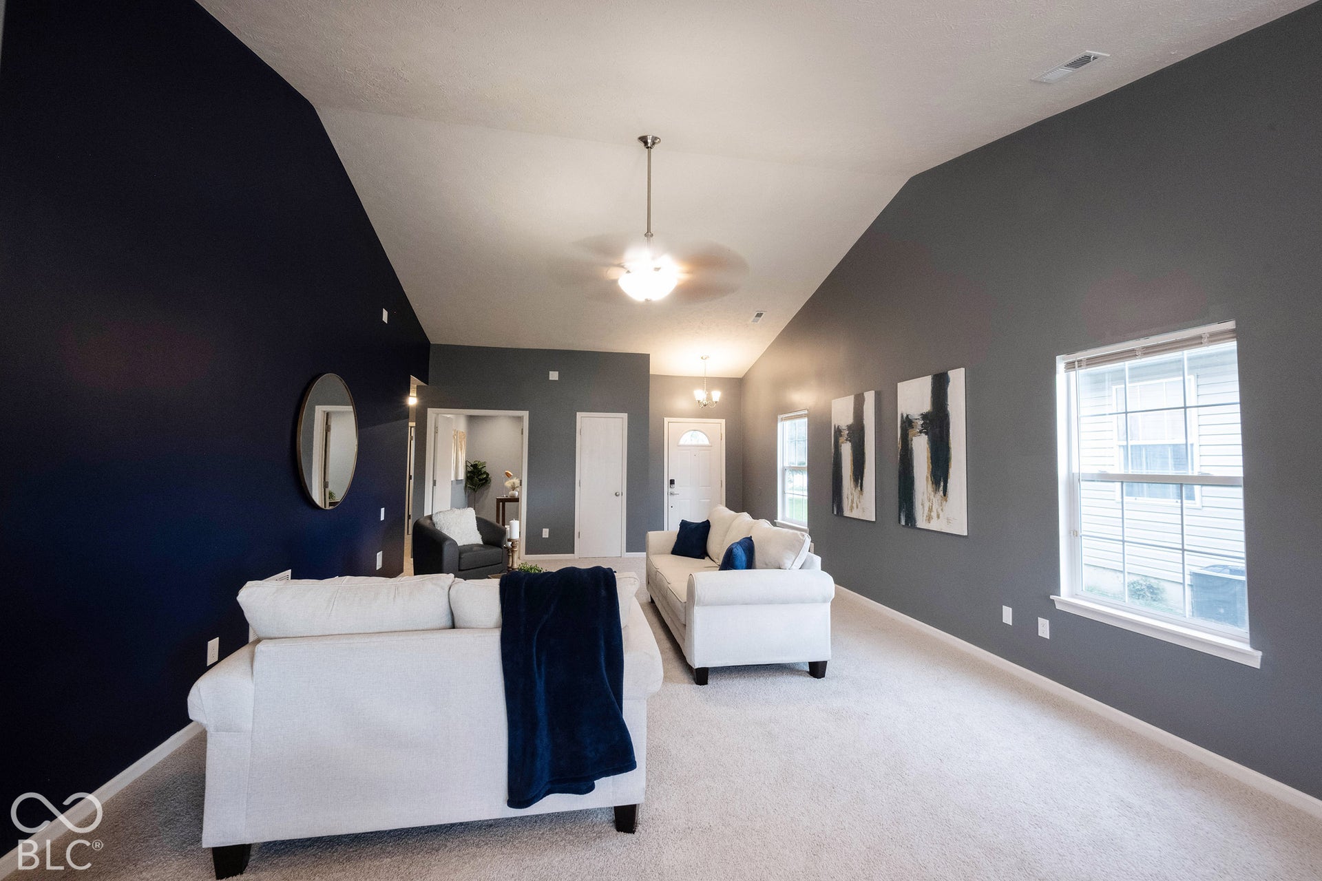 The windows in the living room fill it with natural light, making it feel even larger!