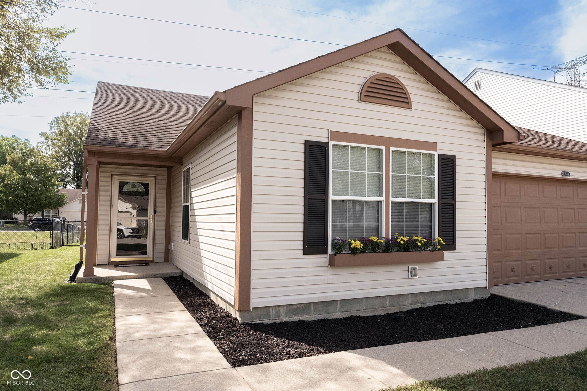 The covered front entry just adds to the charm!