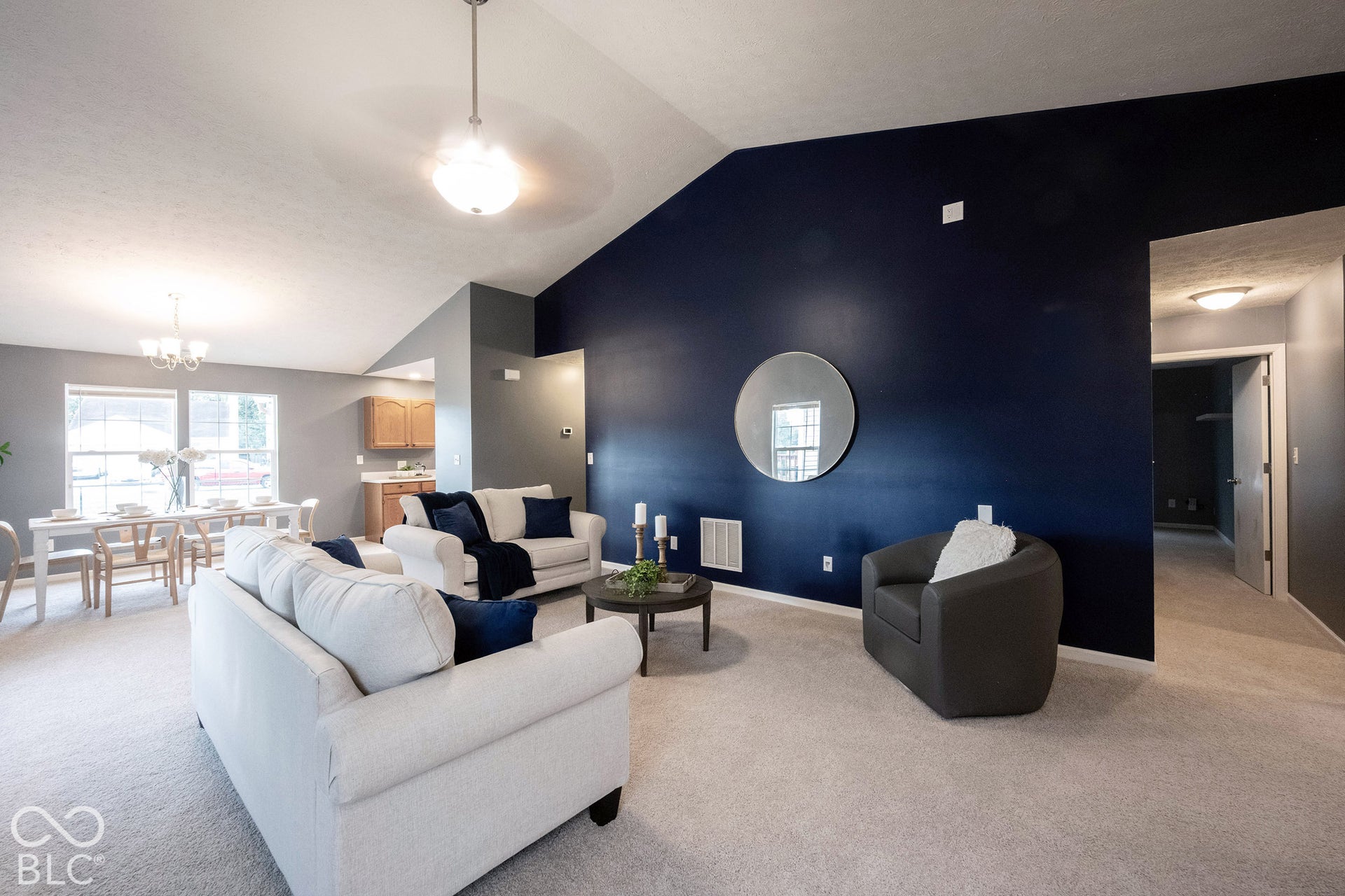 Look at how spacious this living room is, with its vaulted ceiling!