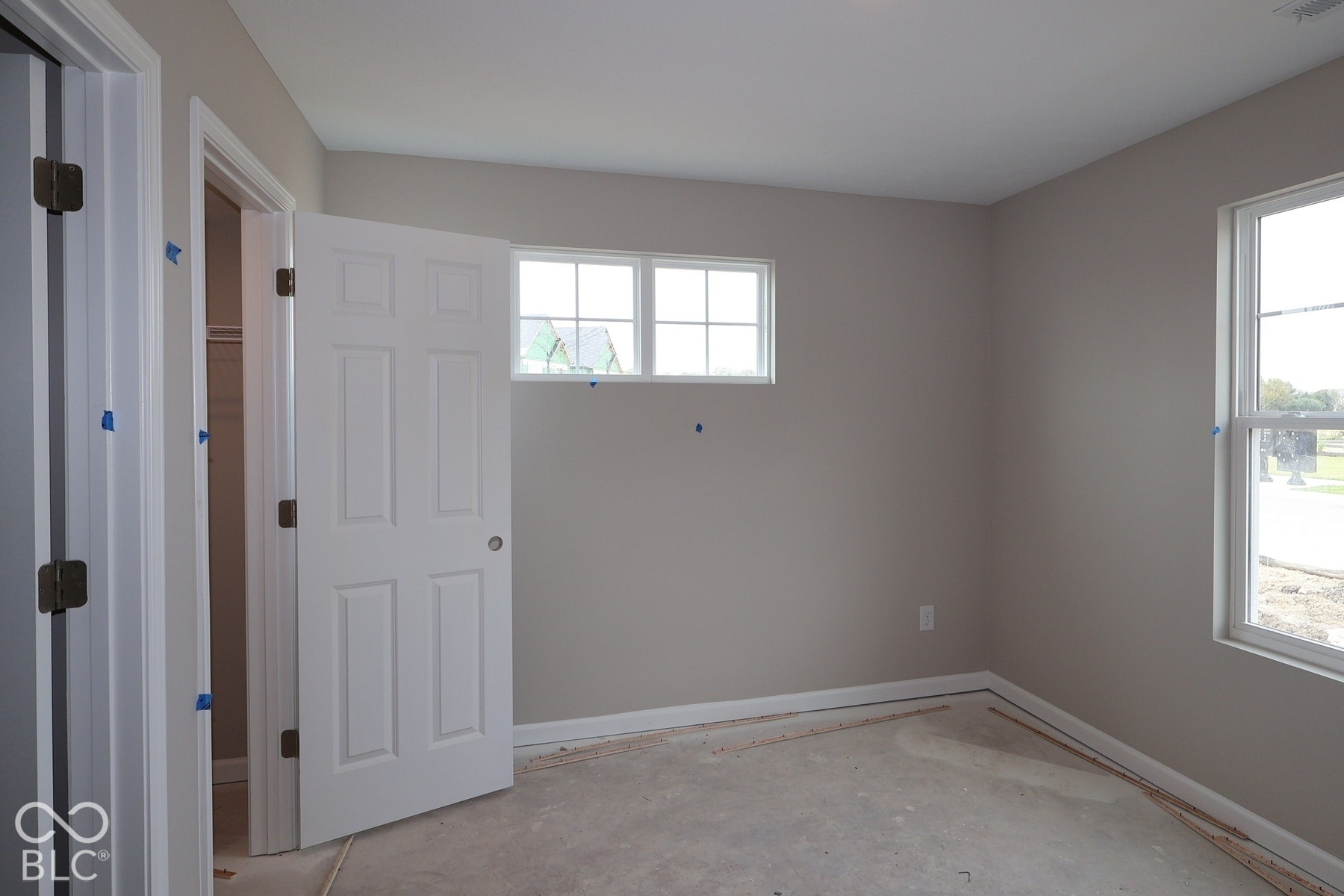 Neutral wall finishes, white trim, and multiple windows