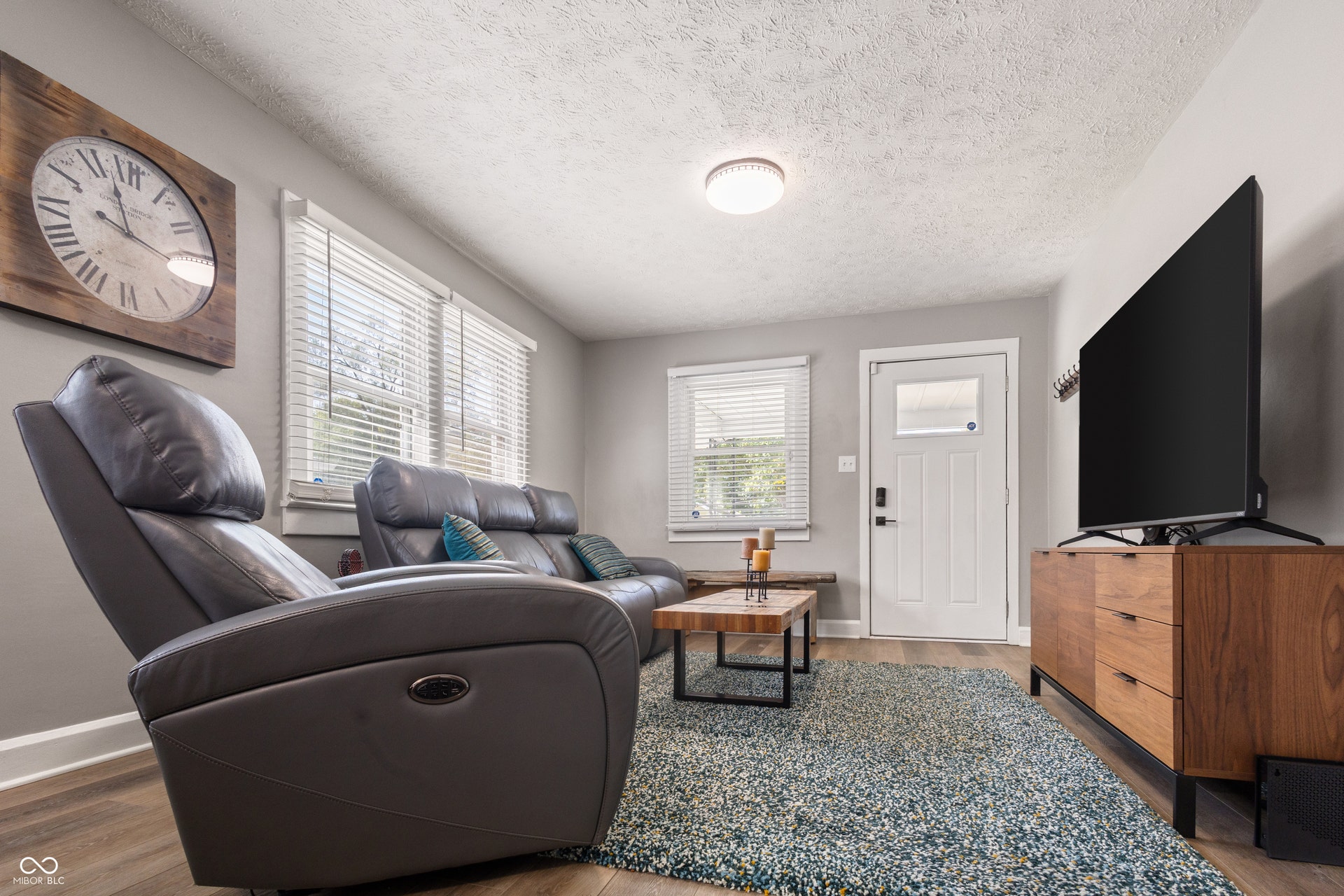 4927 Caroline Avenue, Indianapolis, IN 46205 Recessed lighting, wood-finish flooring, white paneled door with frosted glass, and window blinds