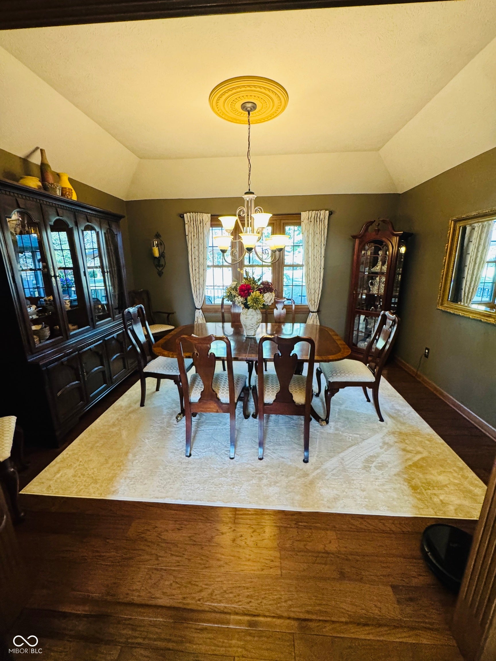 Tray ceiling with a decorative medallion and chandelier