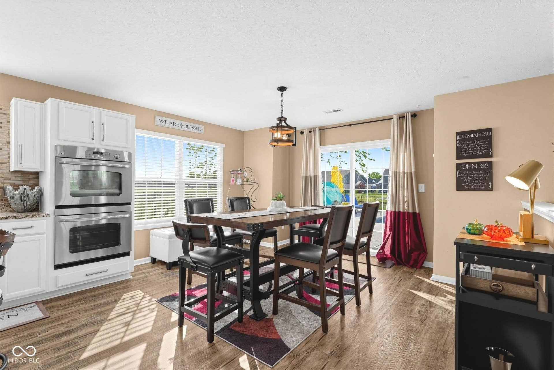 3394 S Bennett Drive, New Palestine, IN 46163 Laminate finish flooring, and a sliding glass door leading to a nice large patio