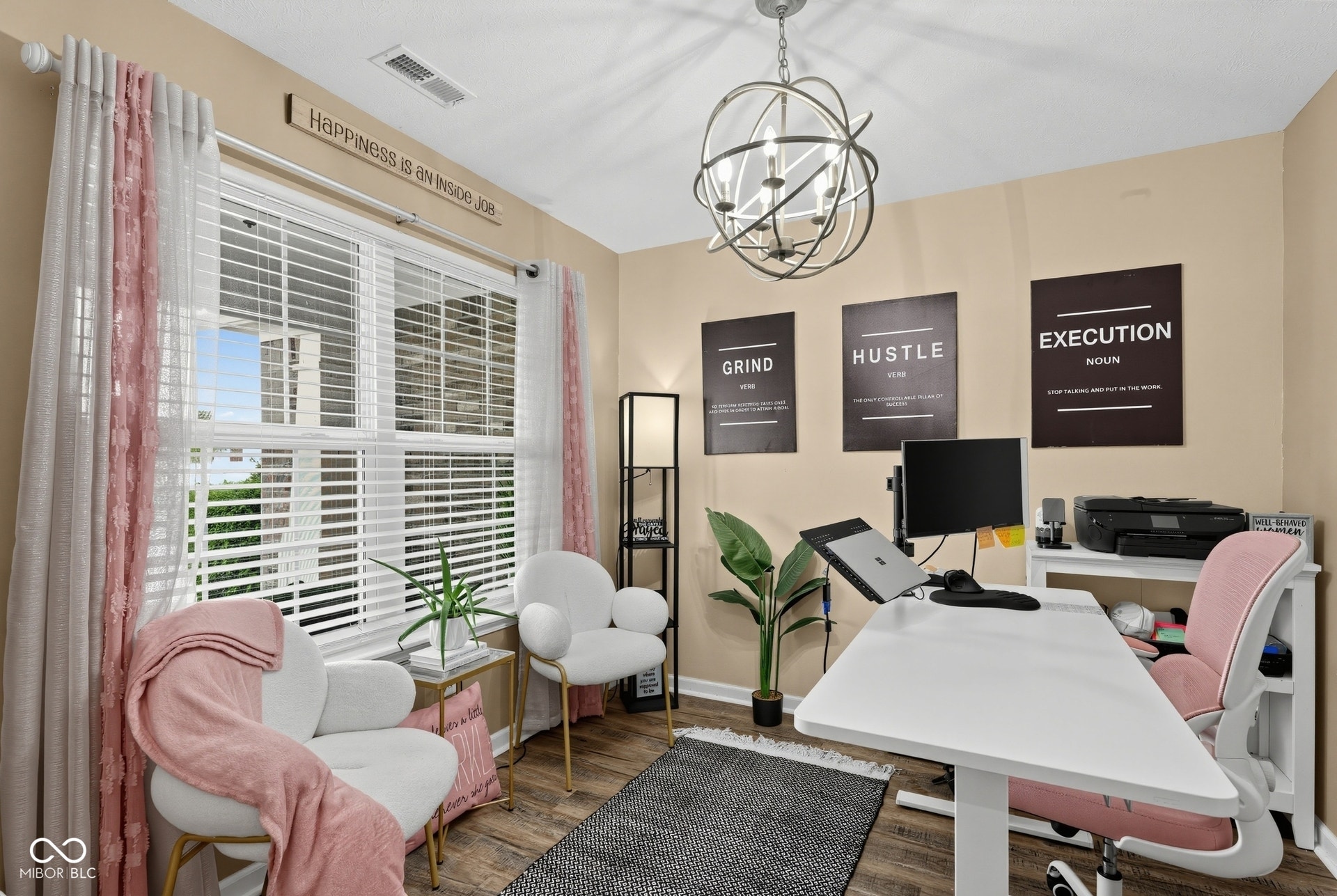 3394 S Bennett Drive, New Palestine, IN 46163 Recessed lighting and a multi-light orb chandelier illuminate this space featuring laminate-finish flooring