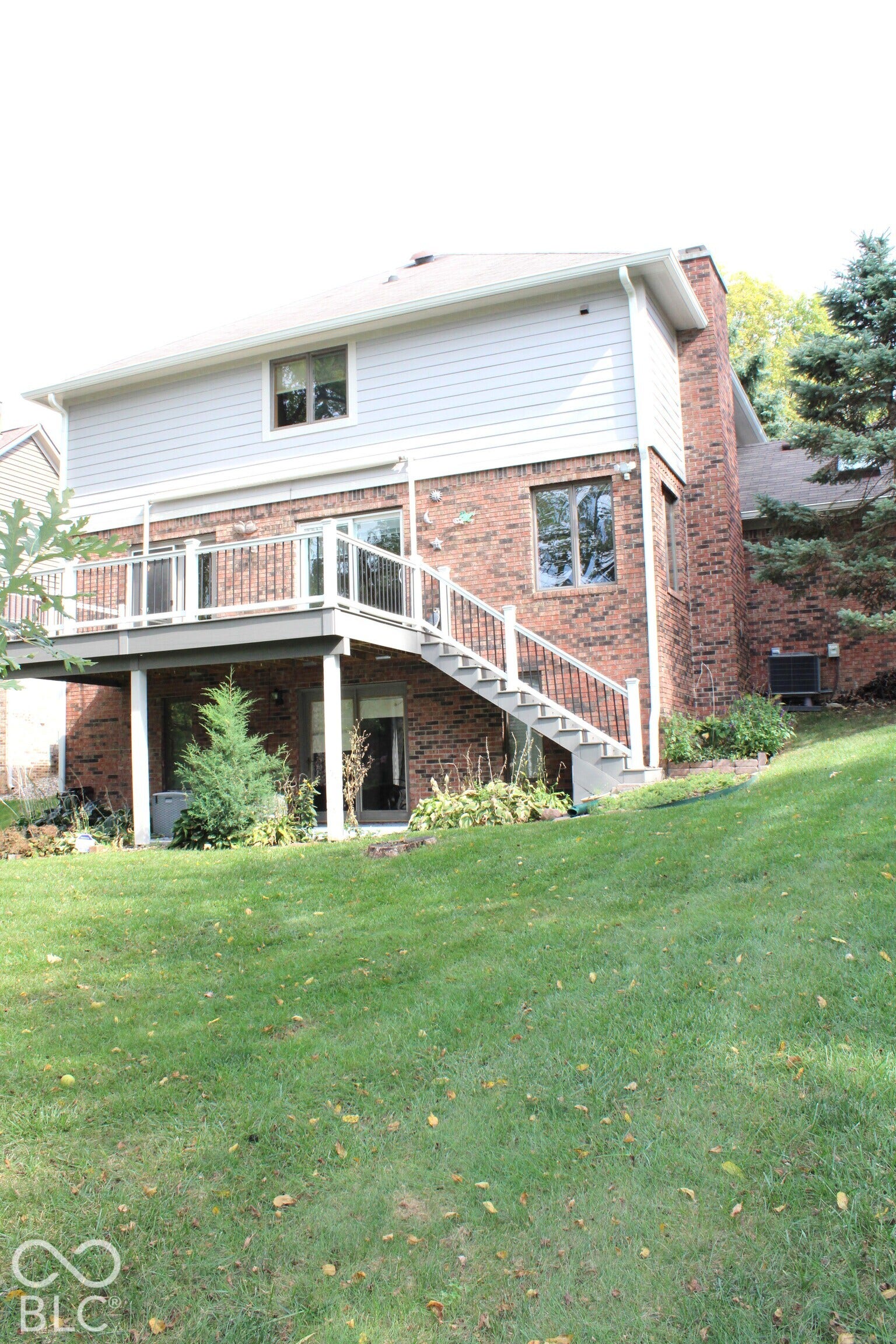 2 Year Old Back Trex Deck off Main with Awning for Shade