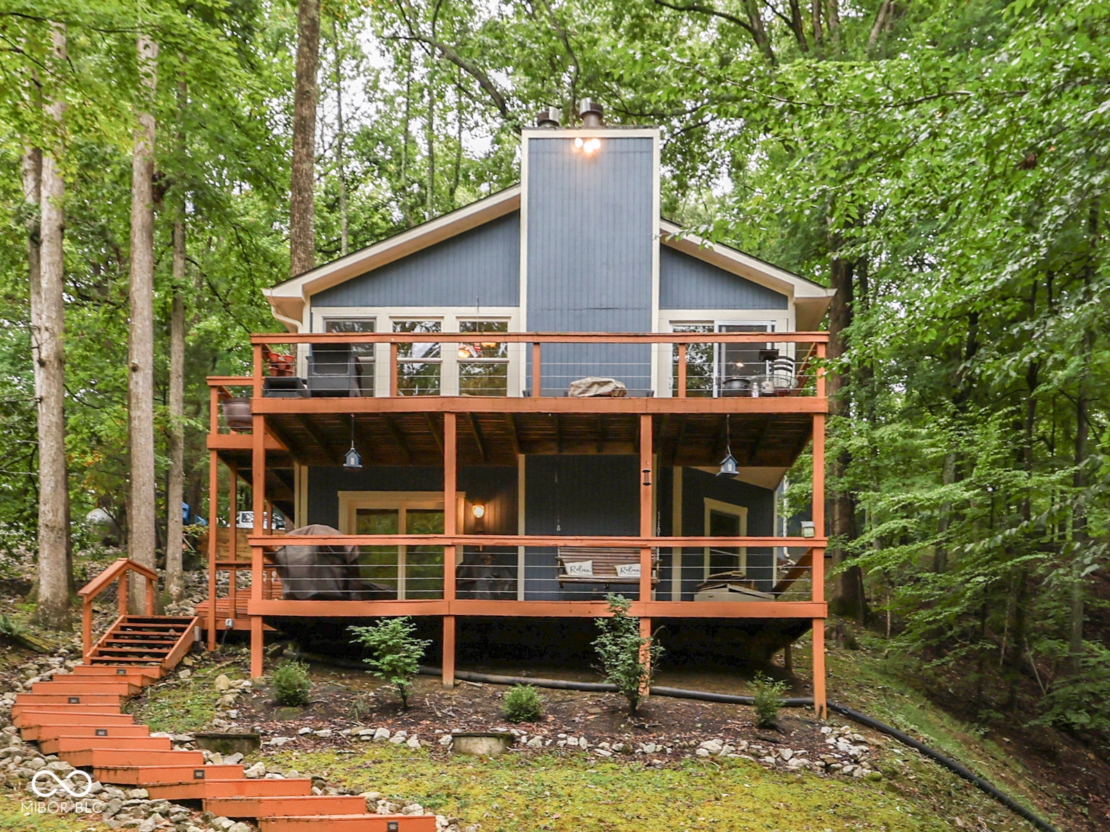Multi-level deck with wood railing and cable infill