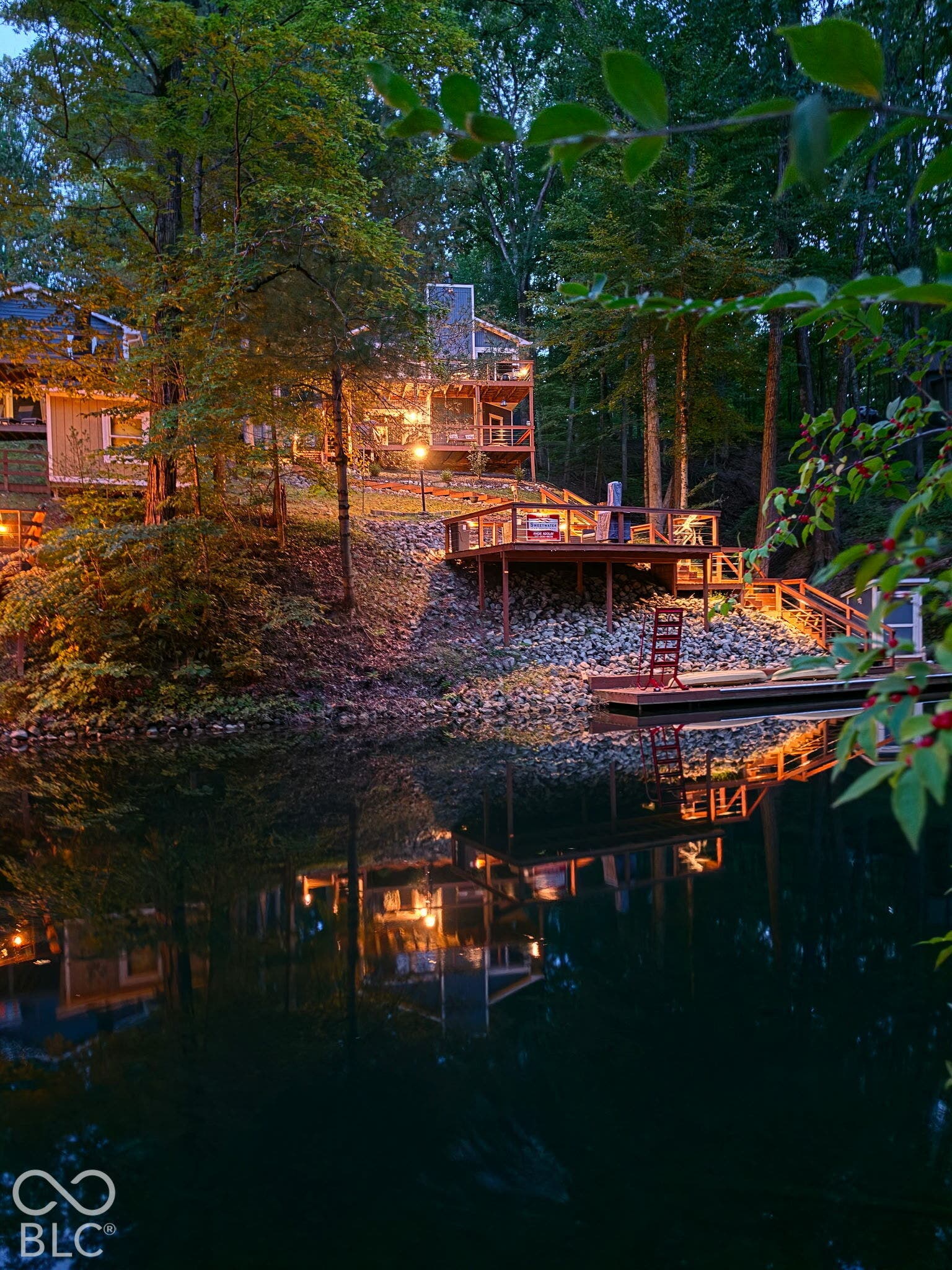 View of home Lake side with the lights on