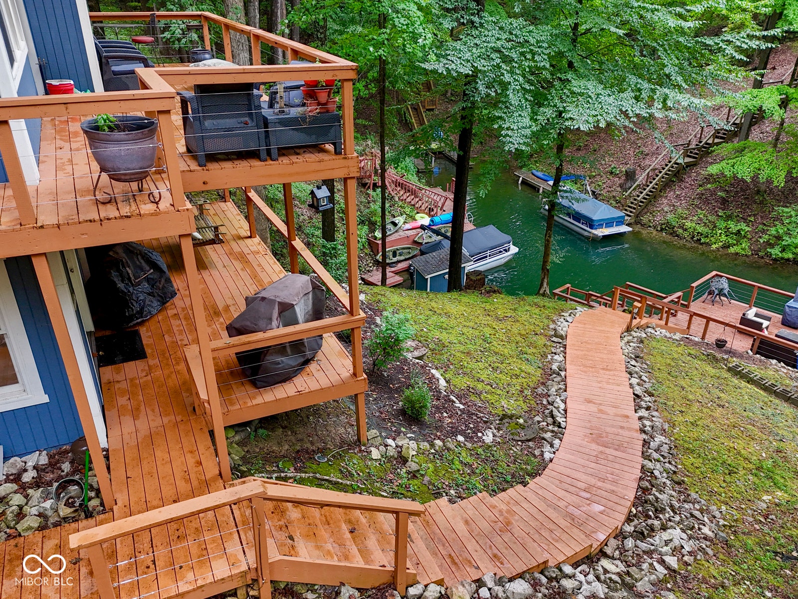 Multi-level deck with wood flooring and cable railings