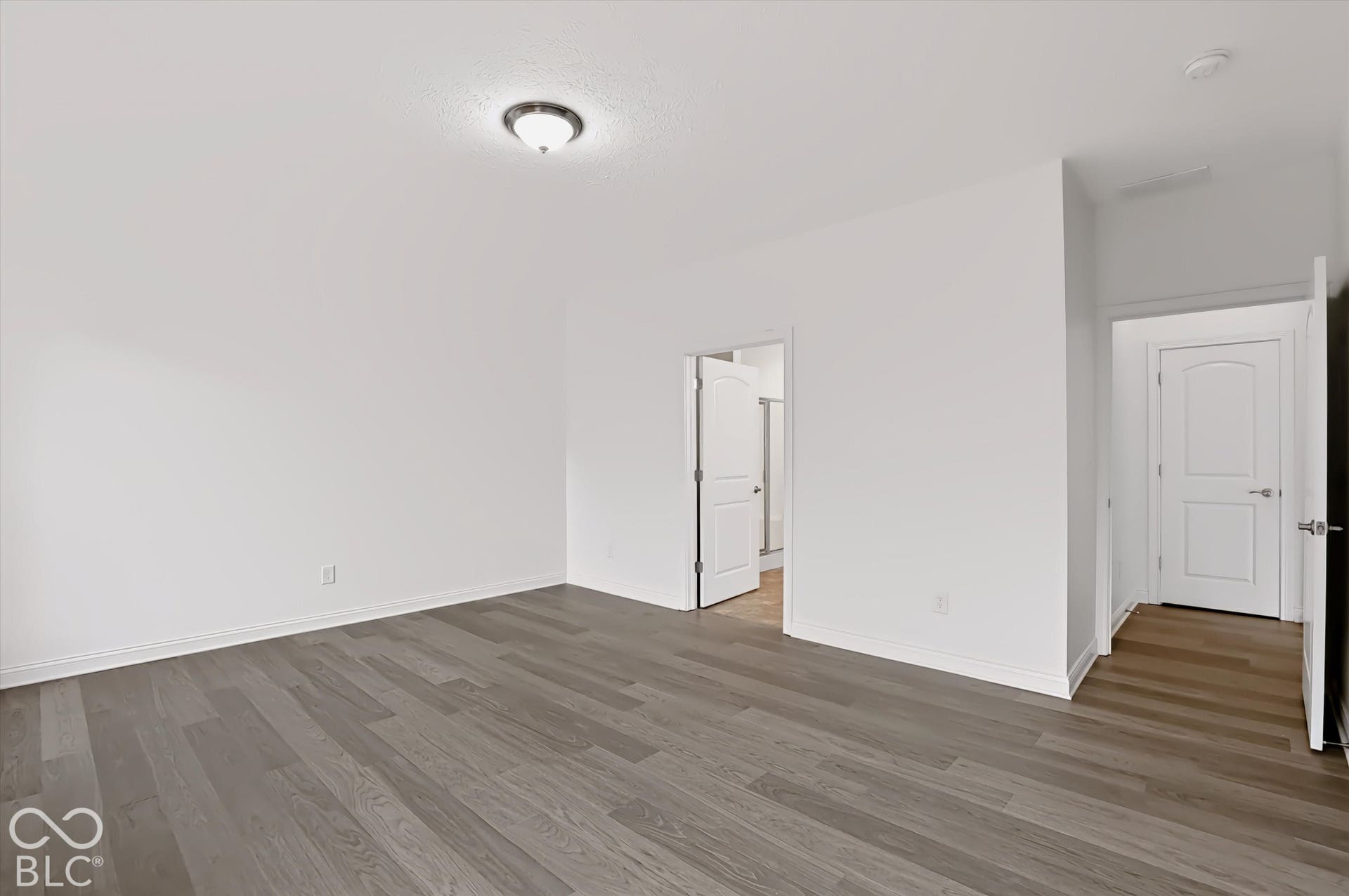 6520 Coughlan Drive, Indianapolis, IN 46278 Spacious interior with neutral wall tones and wood-finish flooring