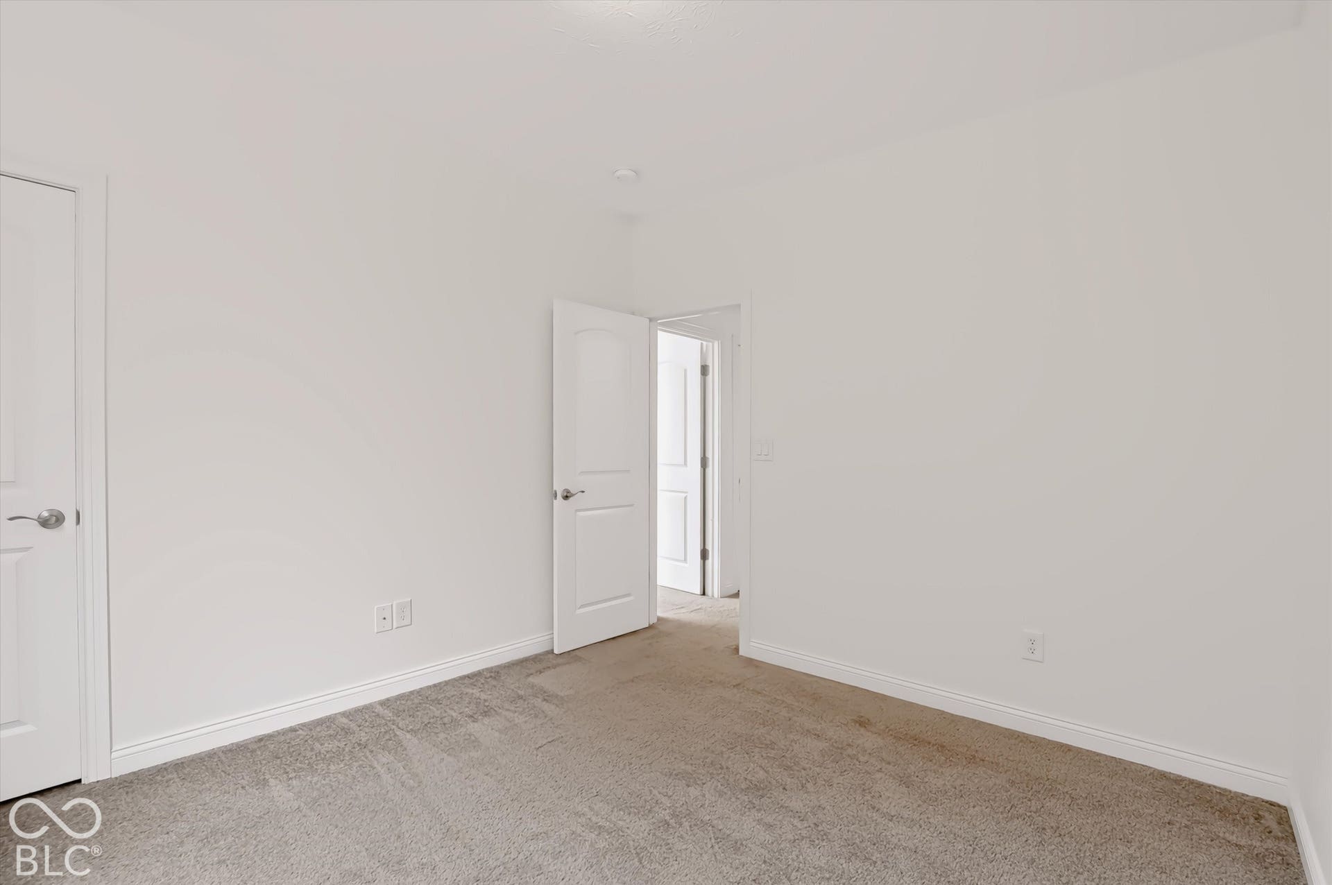 6520 Coughlan Drive, Indianapolis, IN 46278 Light-colored wall-to-wall carpeting, white painted walls, white interior doors, and white baseboards