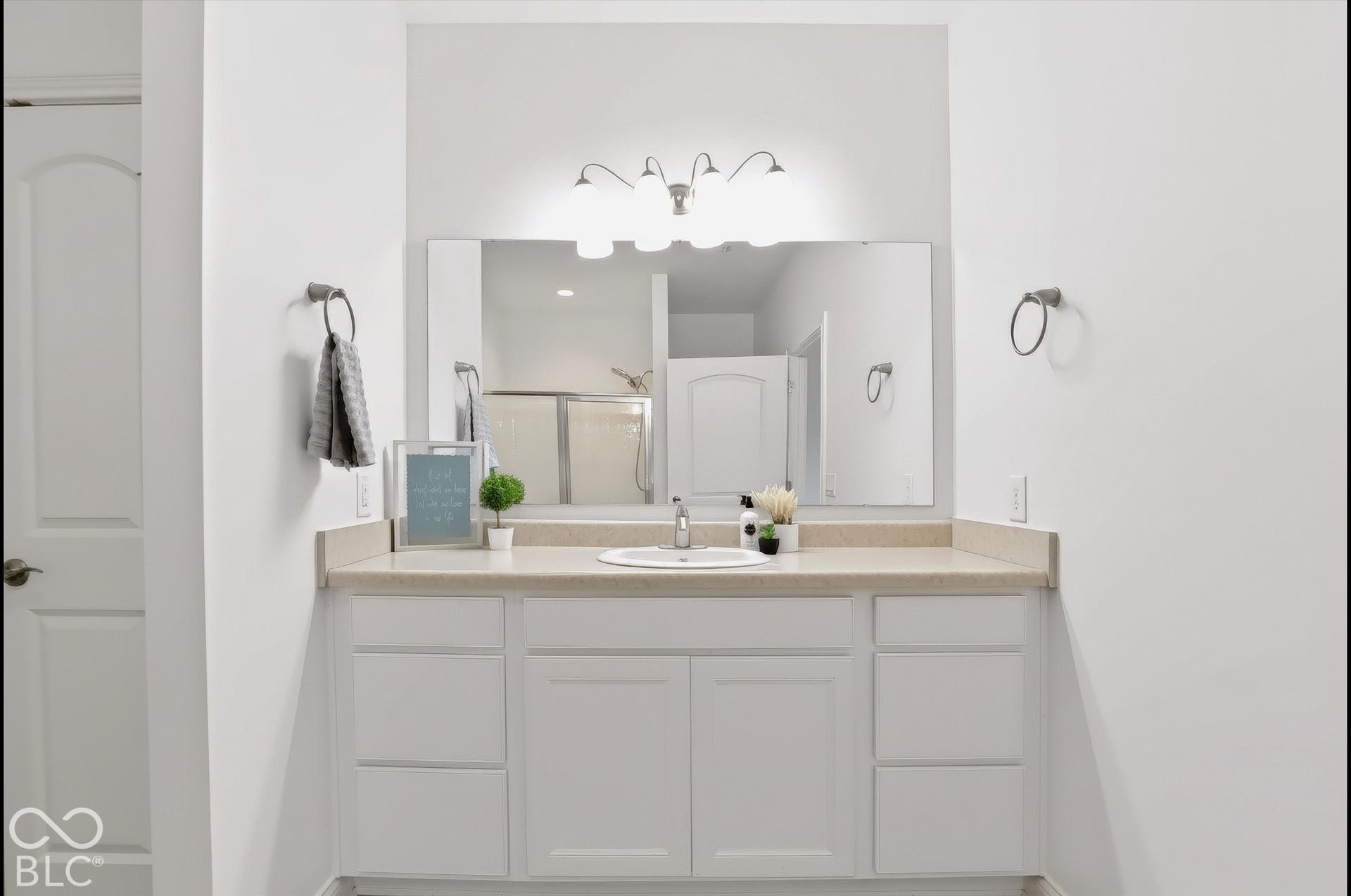 6520 Coughlan Drive, Indianapolis, IN 46278 Vanity with a single basin, light-toned countertop, and white cabinetry