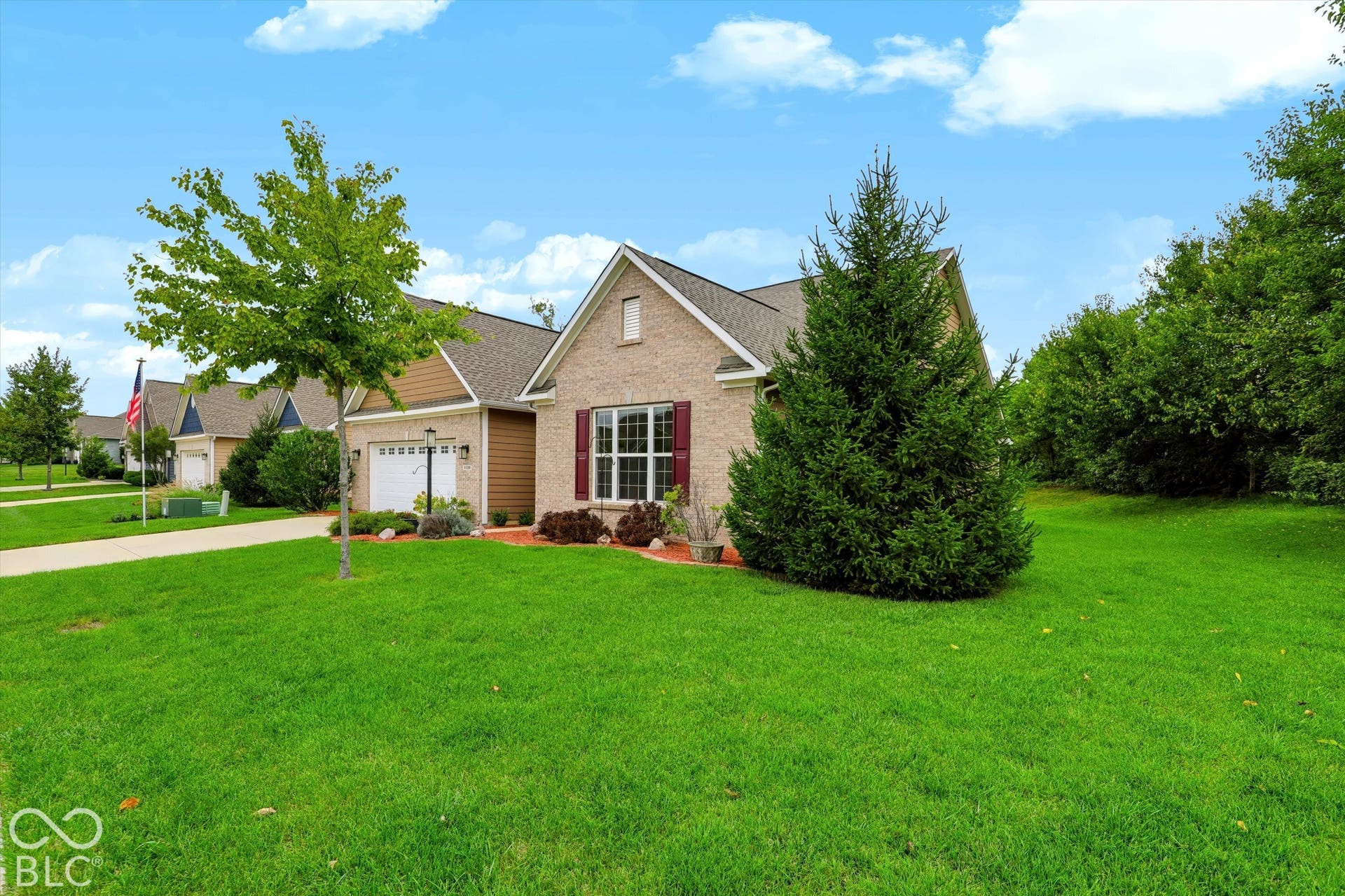 6520 Coughlan Drive, Indianapolis, IN 46278 Brick facade with a gabled roof and a two-car garage