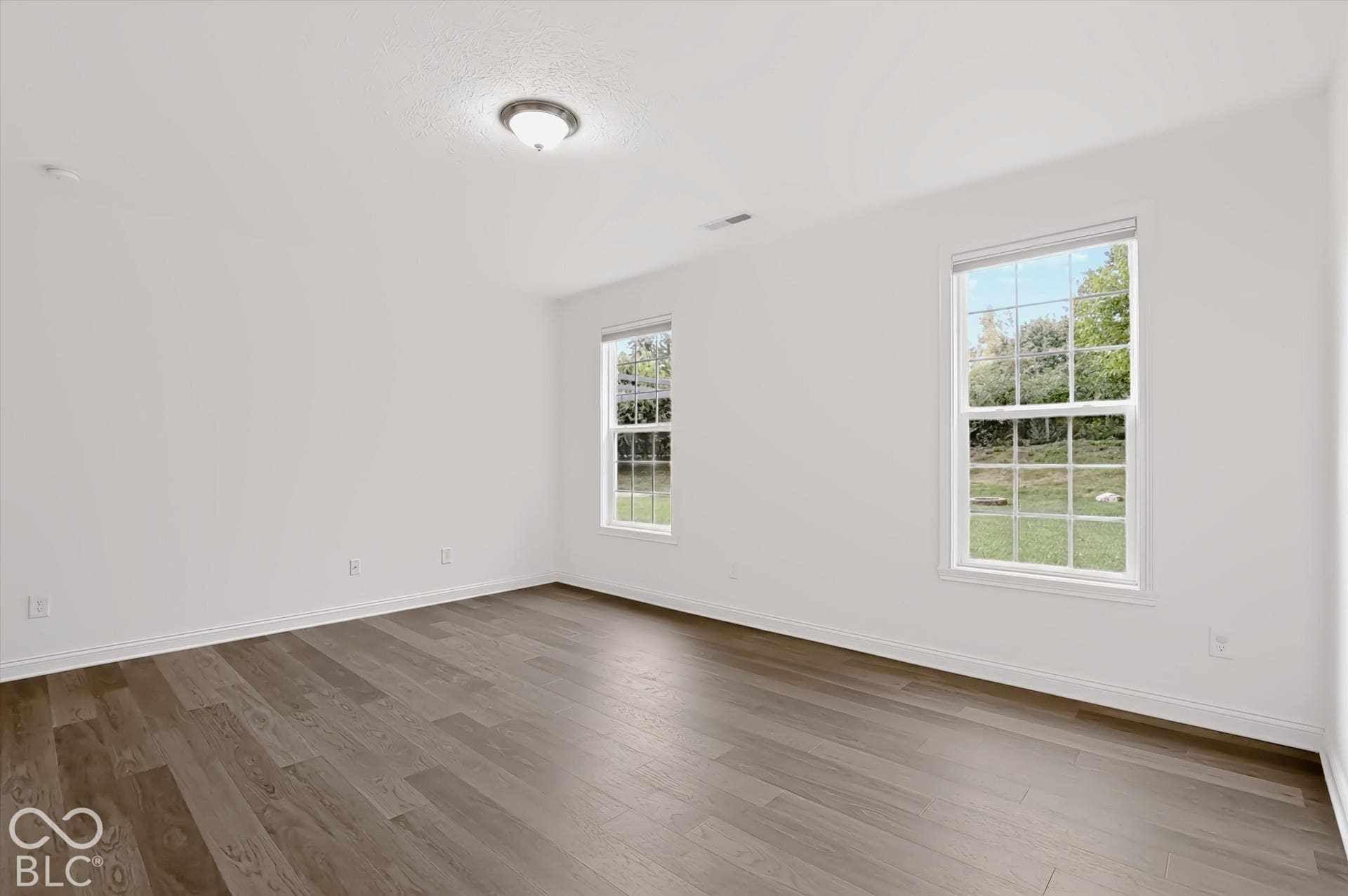 6520 Coughlan Drive, Indianapolis, IN 46278 Wood-finish flooring with white walls and trim