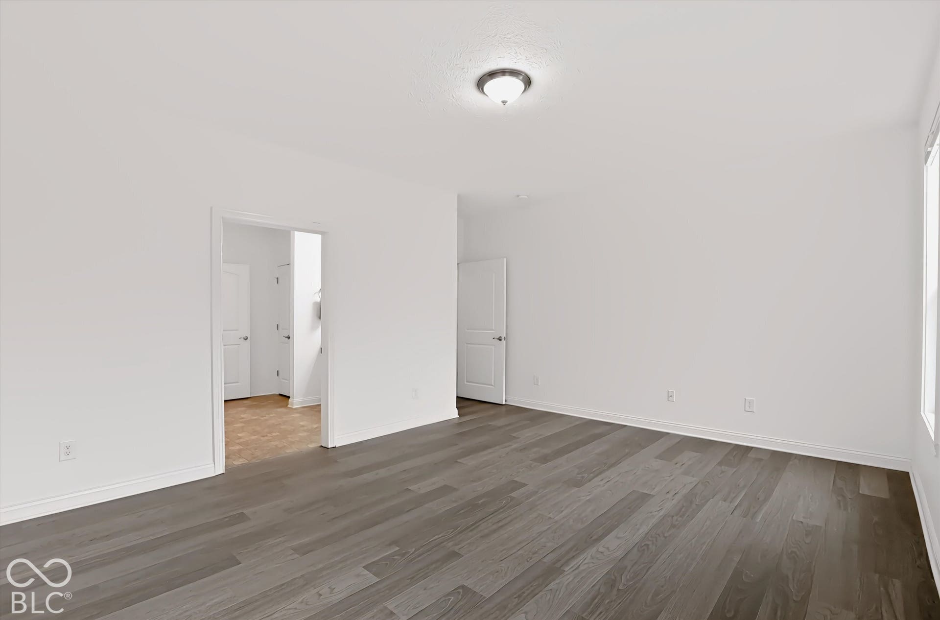 6520 Coughlan Drive, Indianapolis, IN 46278 Light wood-finish flooring, white walls, and a semi-flush mount ceiling fixture
