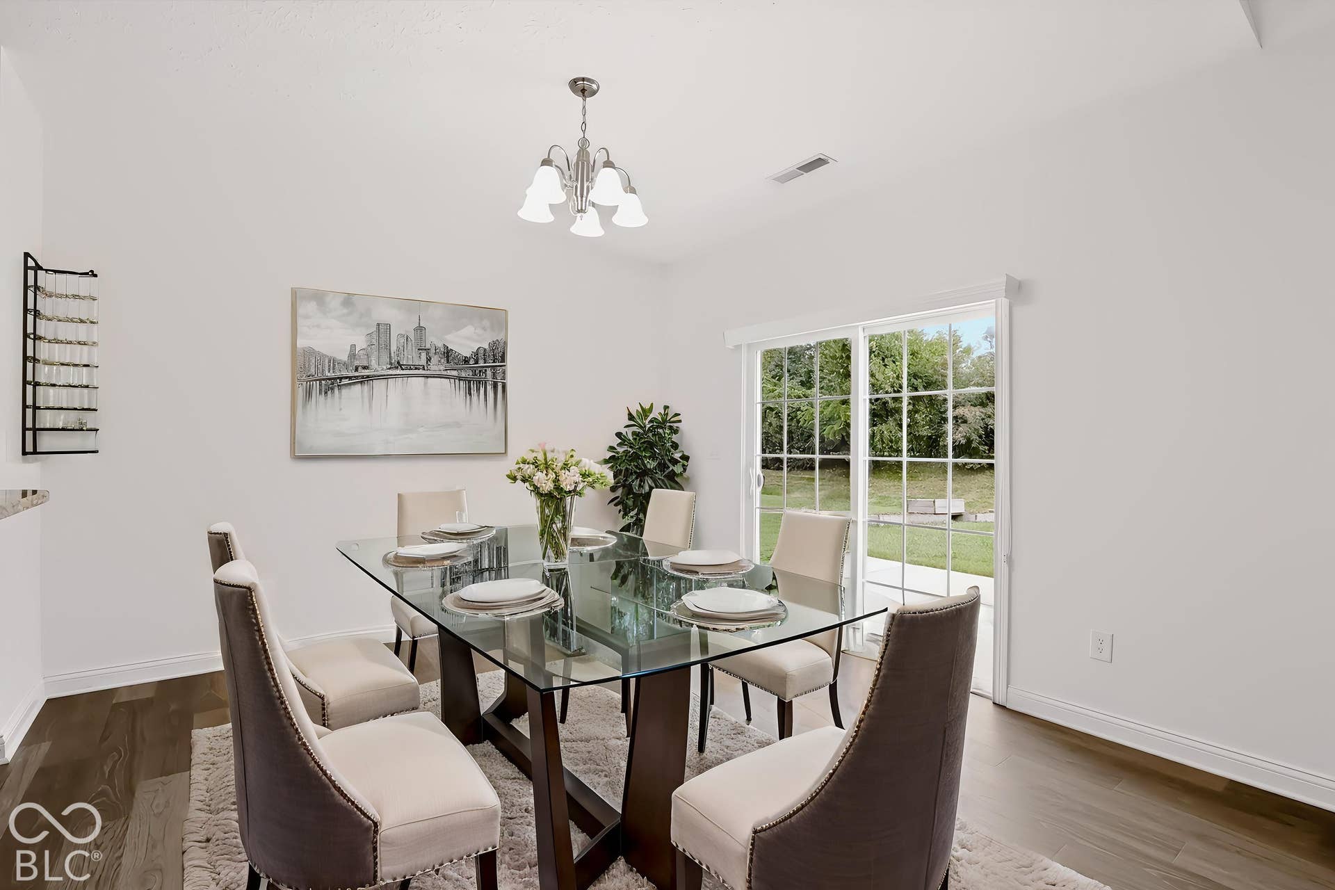 6520 Coughlan Drive, Indianapolis, IN 46278 Wood-finish flooring with white baseboards and neutral wall paint