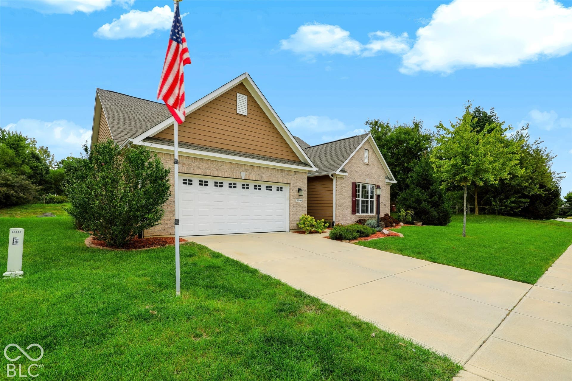 6520 Coughlan Drive, Indianapolis, IN 46278 Brick and siding exterior with a gabled roof