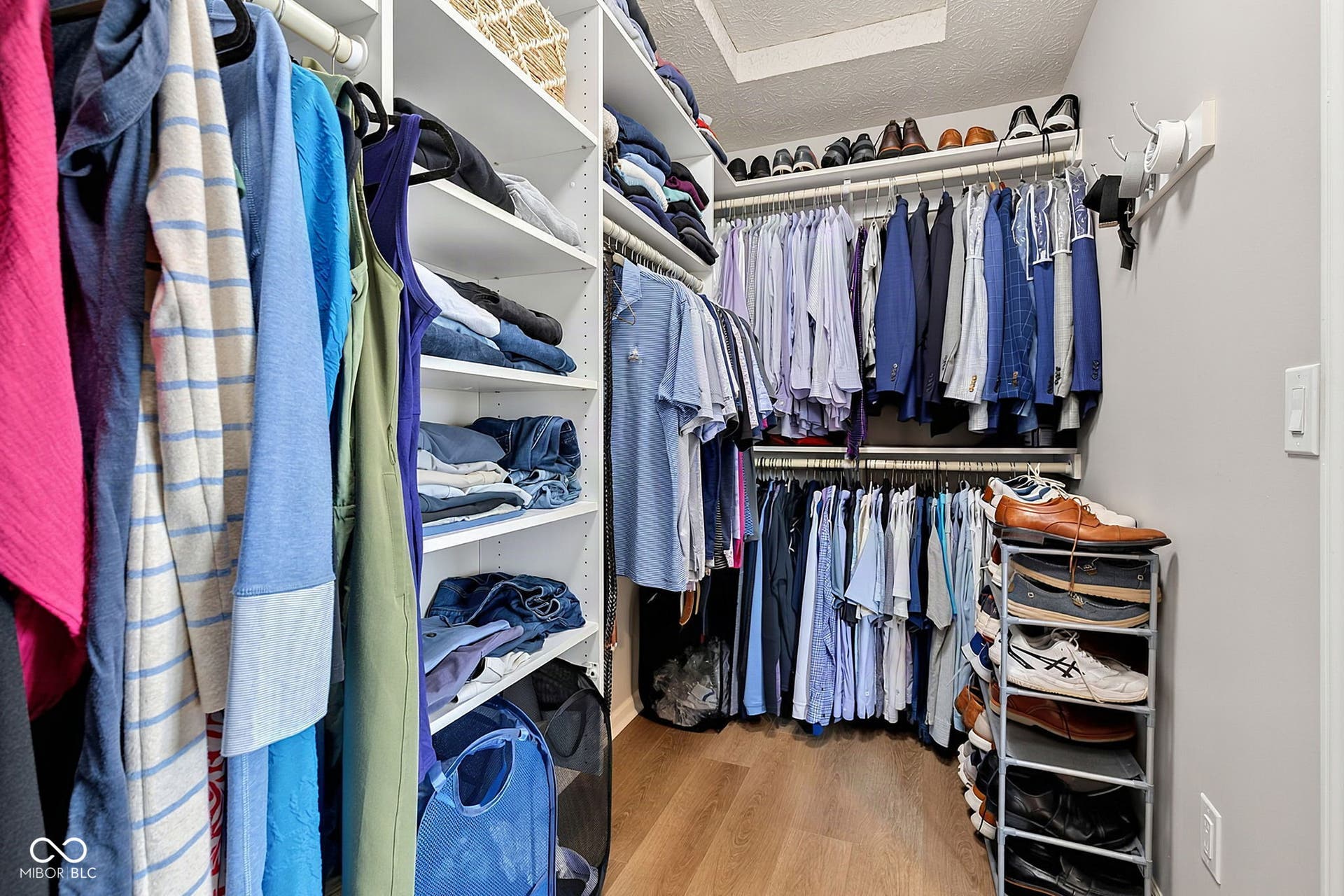 Custom closet system in primary ensuite.