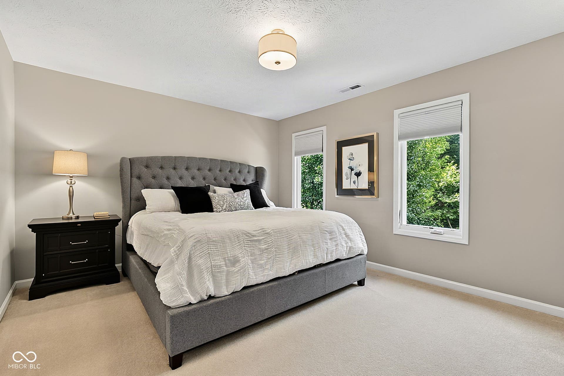 Bedroom #2 faces front of home and has its own full bath!