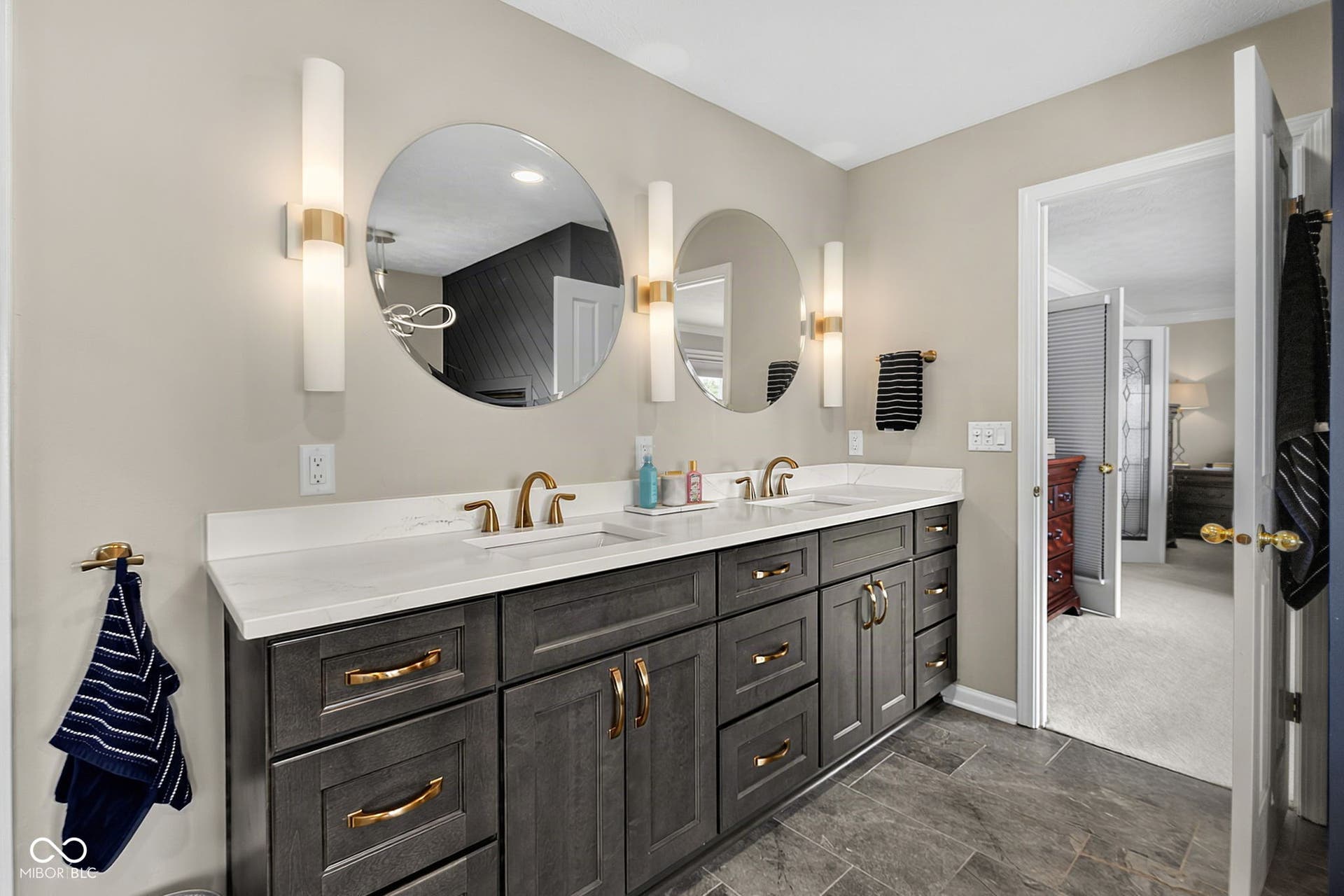 Dual vanity in recently updated primary bathroom.