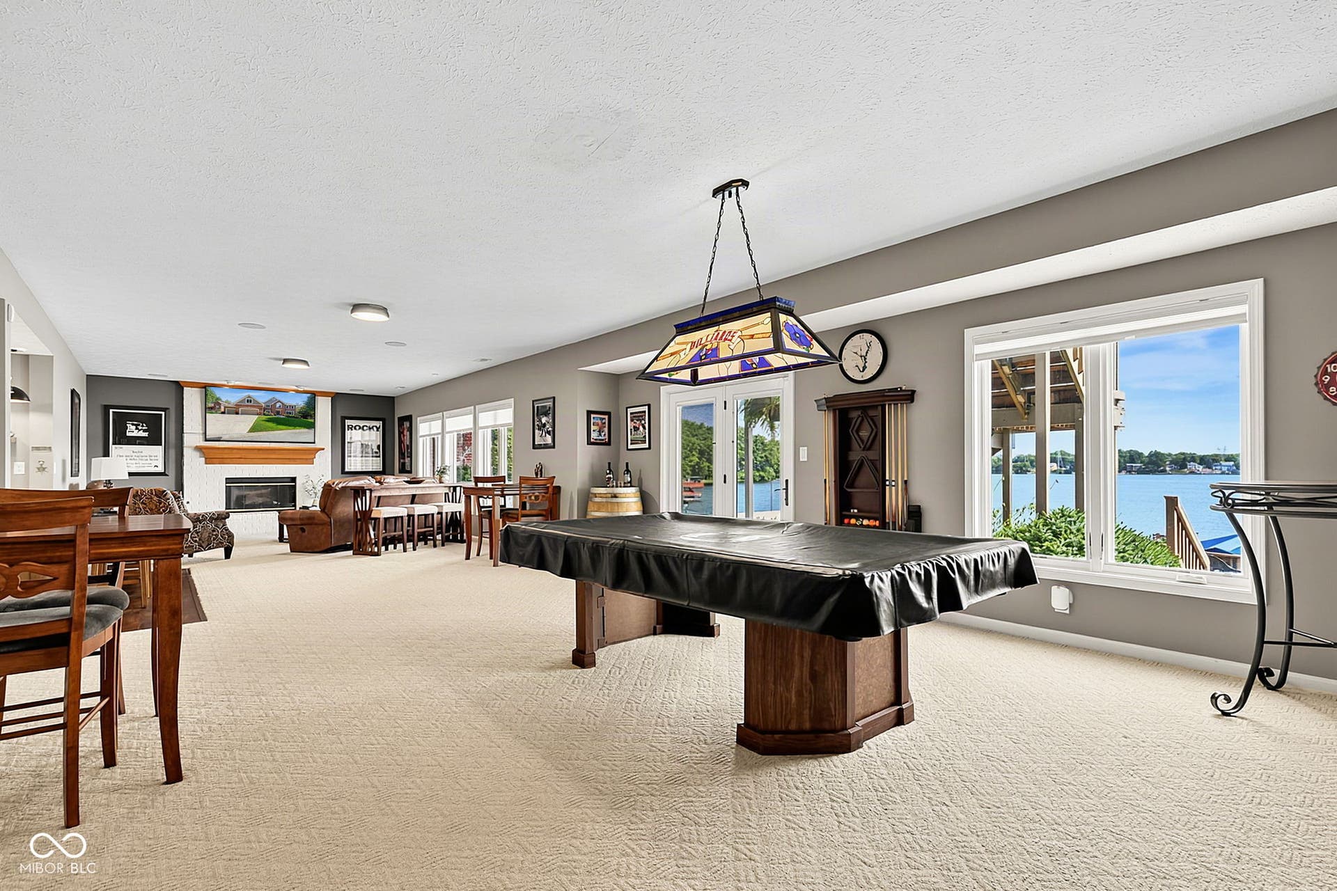 Expansive lower level with access to lower deck - natural light and views of lake.