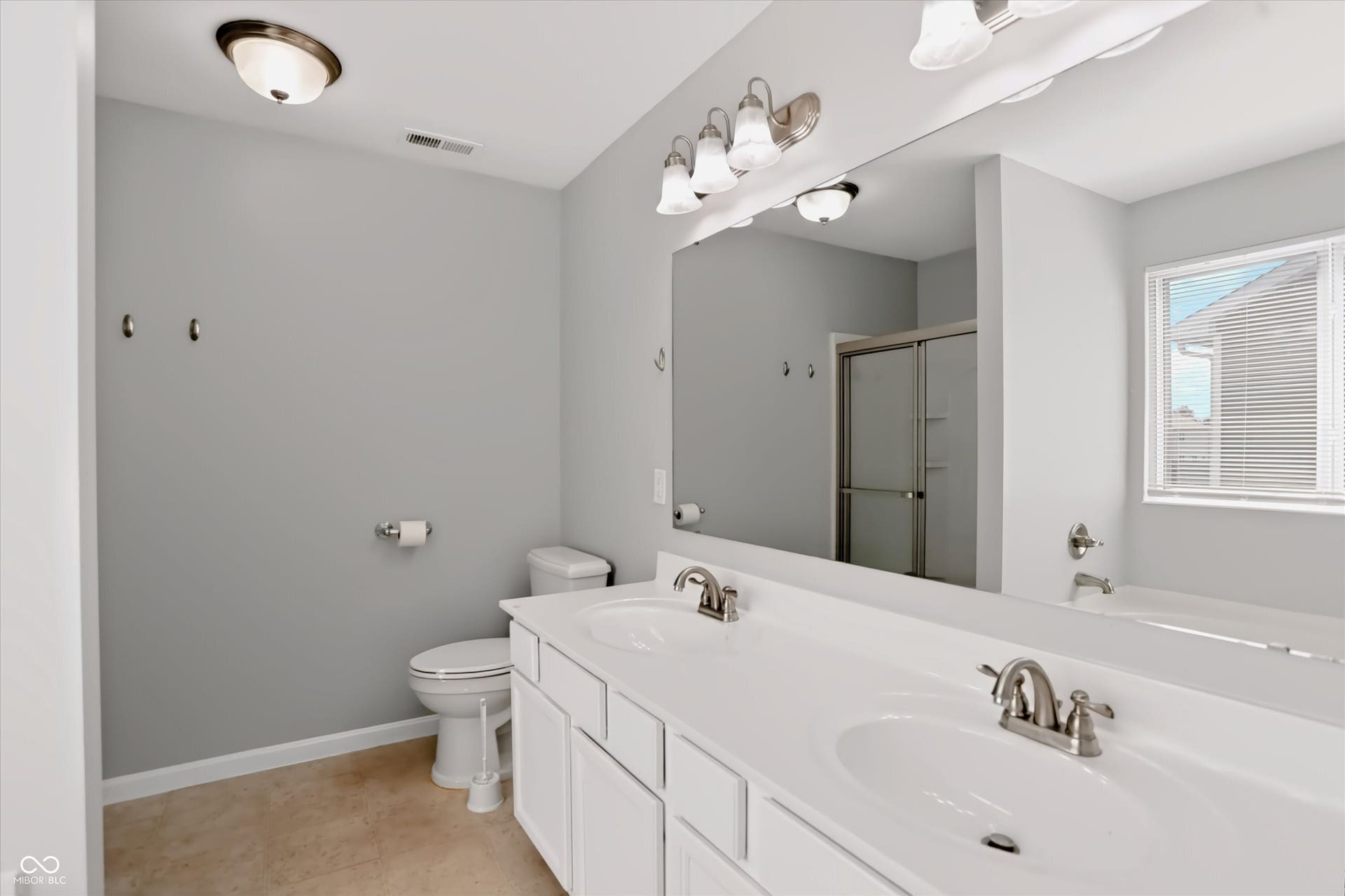 2536 Autumn Road, Indianapolis, IN 46229 Dual vanity with white cabinetry and integrated sinks