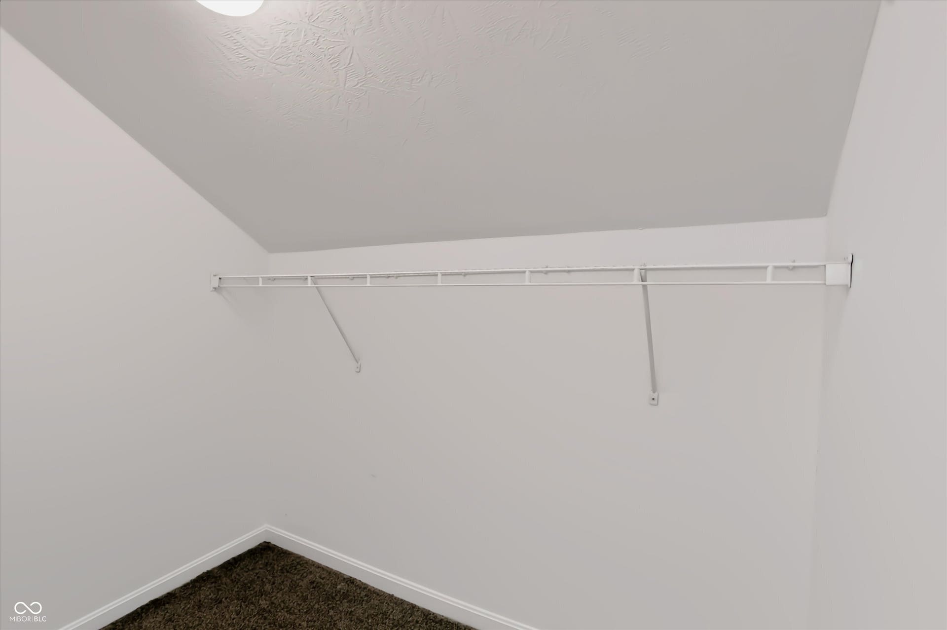 2536 Autumn Road, Indianapolis, IN 46229 Built-in wire shelving with wall-mounted supports, carpeted flooring, and white painted walls