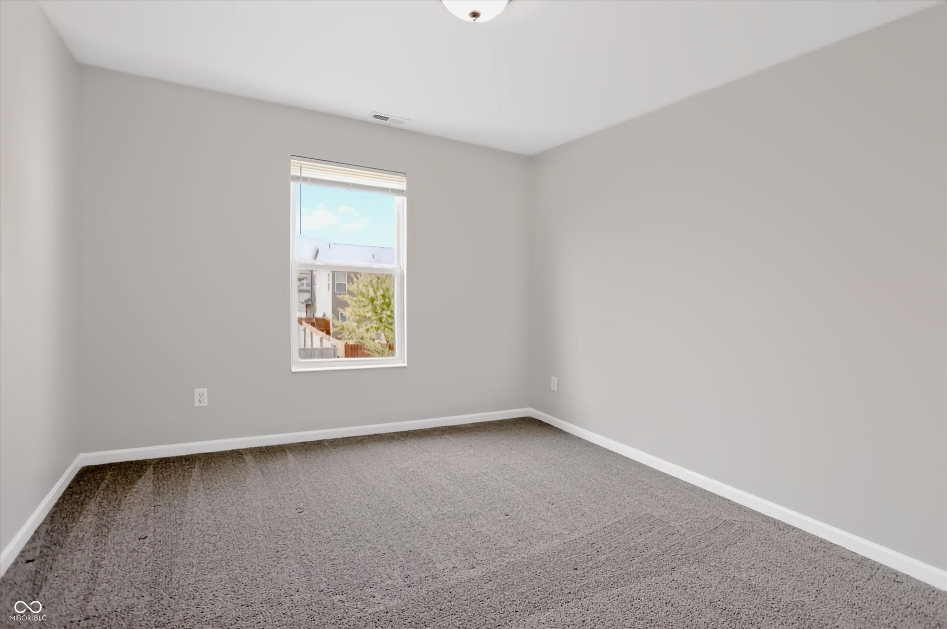 2536 Autumn Road, Indianapolis, IN 46229 Neutral wall paint, gray carpeting, single window, white trim