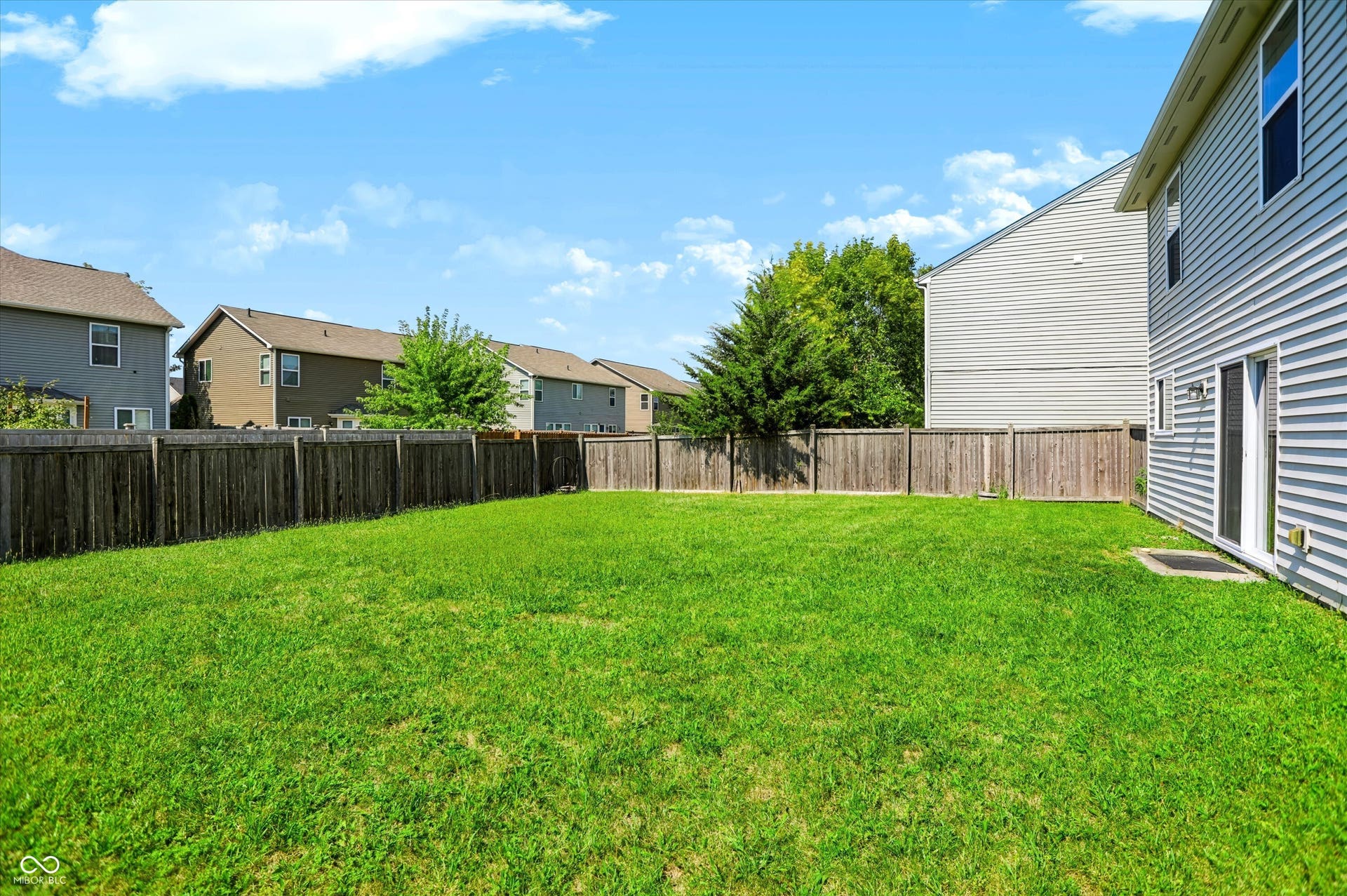 2536 Autumn Road, Indianapolis, IN 46229 Expansive green lawn with a full privacy fence