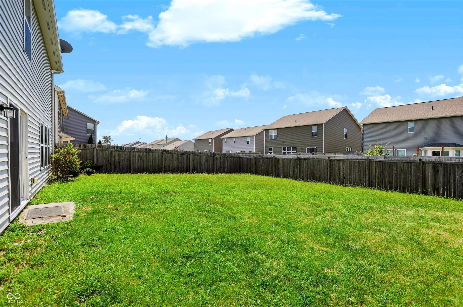 2536 Autumn Road, Indianapolis, IN 46229 Expansive backyard with a full privacy fence and a manicured lawn
