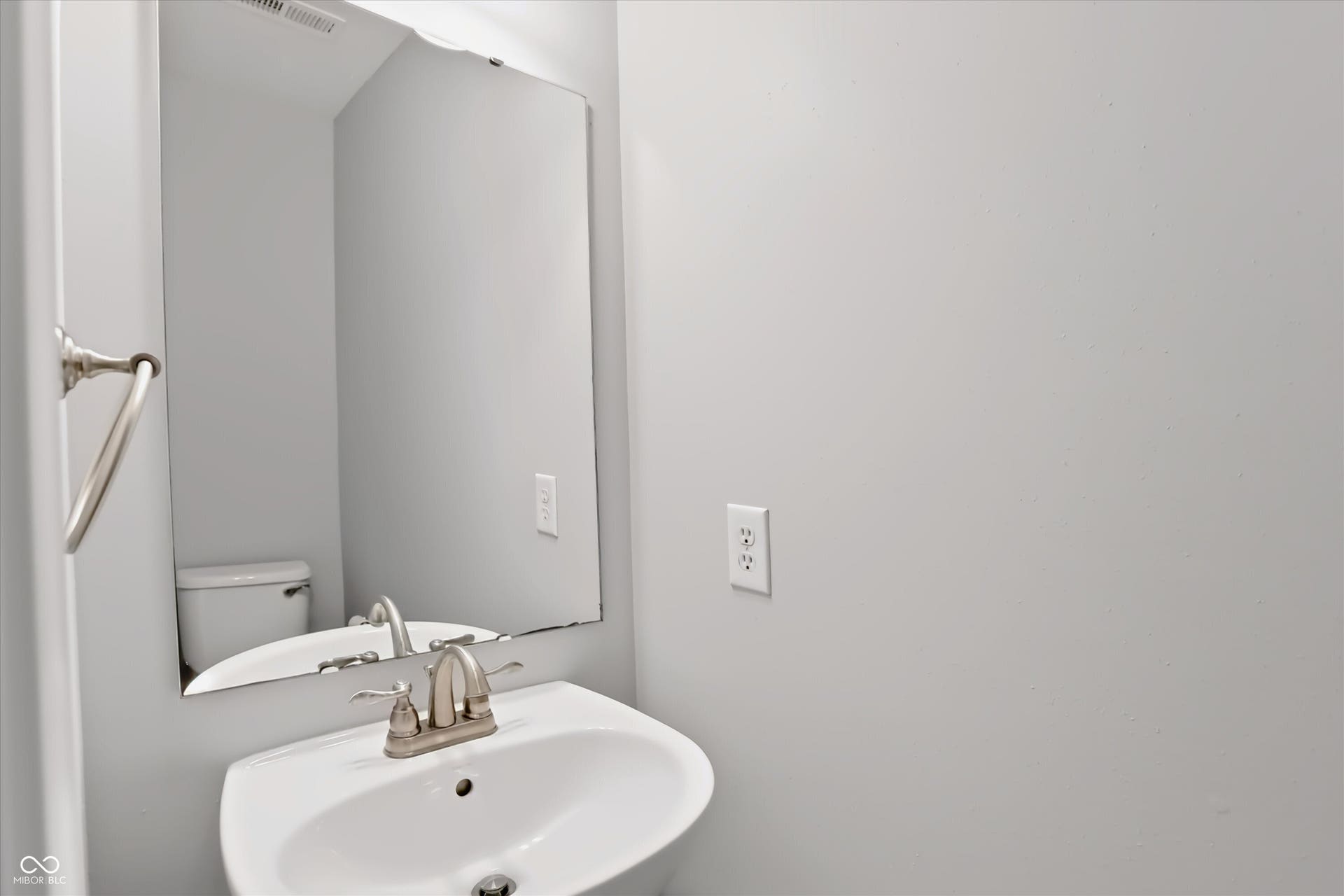 2536 Autumn Road, Indianapolis, IN 46229 White pedestal sink with brushed nickel faucet