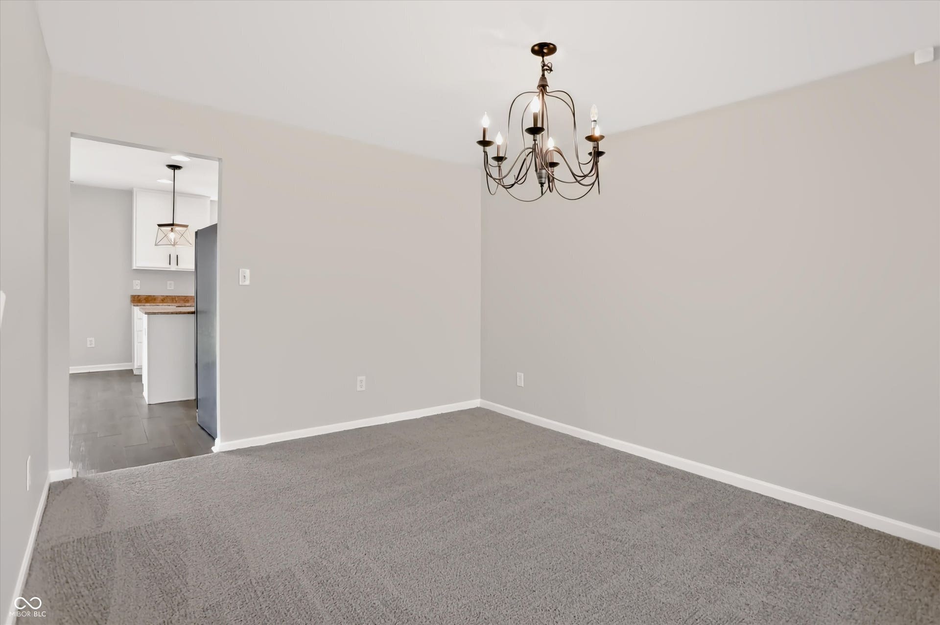 2536 Autumn Road, Indianapolis, IN 46229 Carpeted room with a dark bronze chandelier
