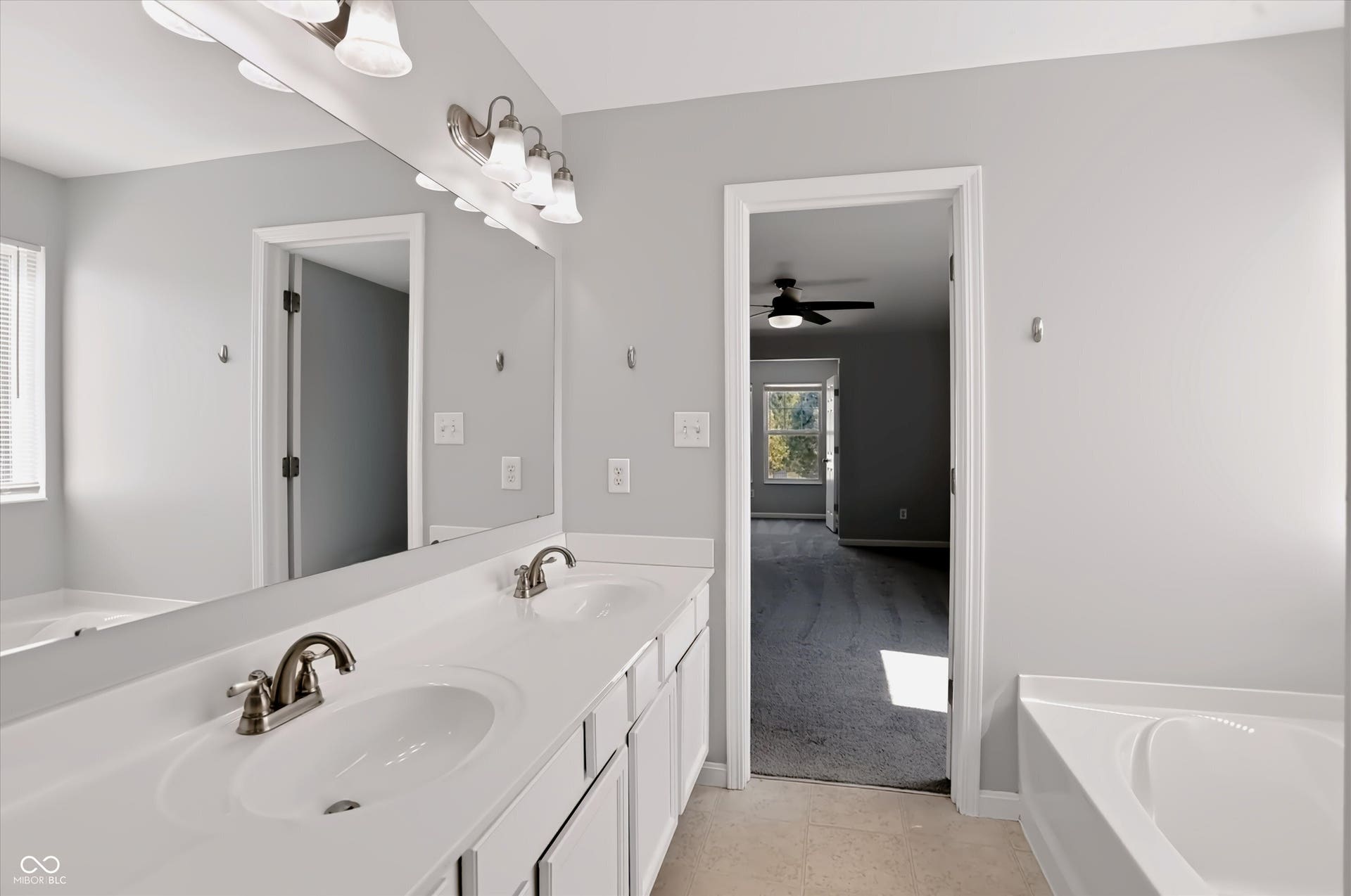 2536 Autumn Road, Indianapolis, IN 46229 Dual vanity with brushed nickel fixtures, under-mount sinks, and white cabinetry