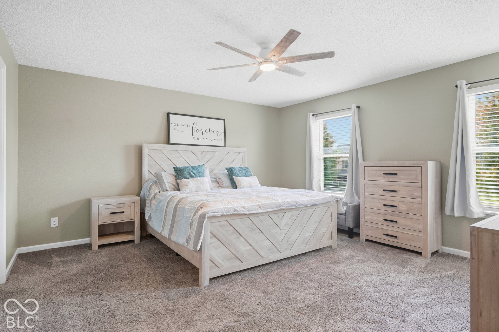Carpeted flooring, neutral wall tones, and overhead lighting