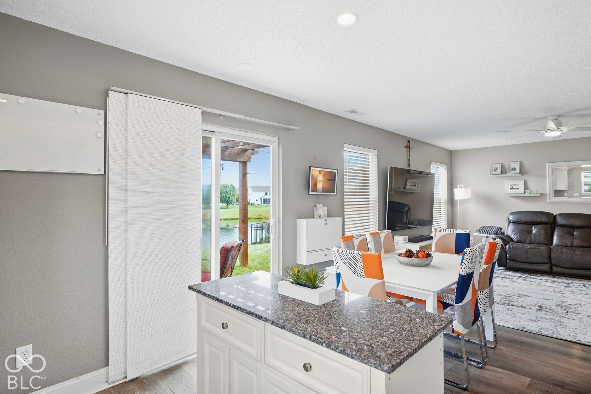 White kitchen island with a quartz-style countertop and cabinet storage