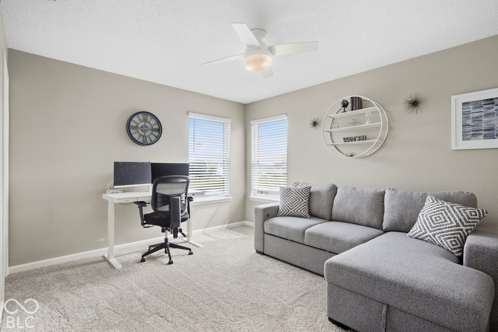 Textured carpeting complements neutral wall tones