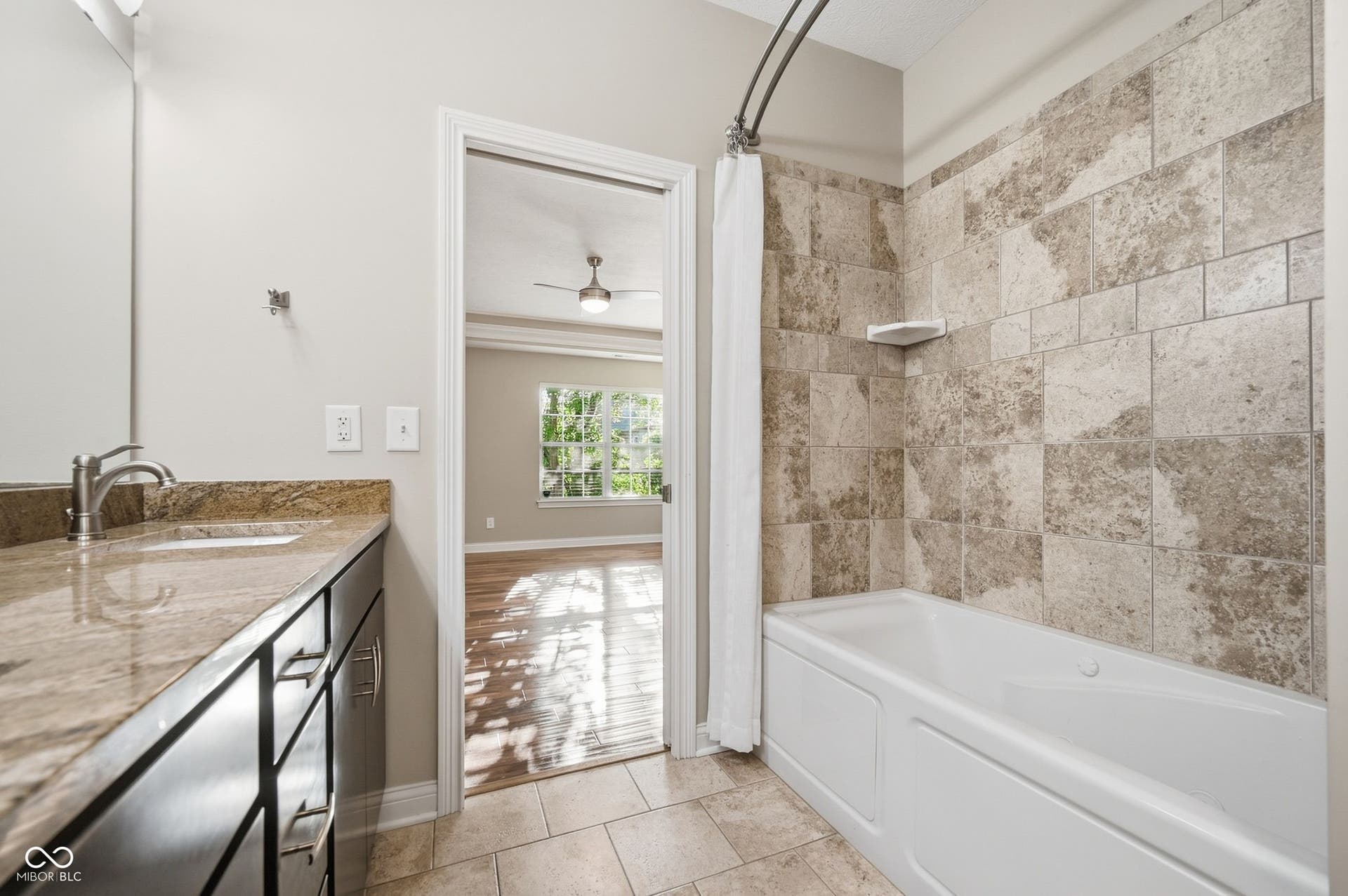2743 Rylee Court, Greenwood, IN 46143 Bathroom featuring a single vanity with stone countertop, undermount sink, and brushed nickel faucet