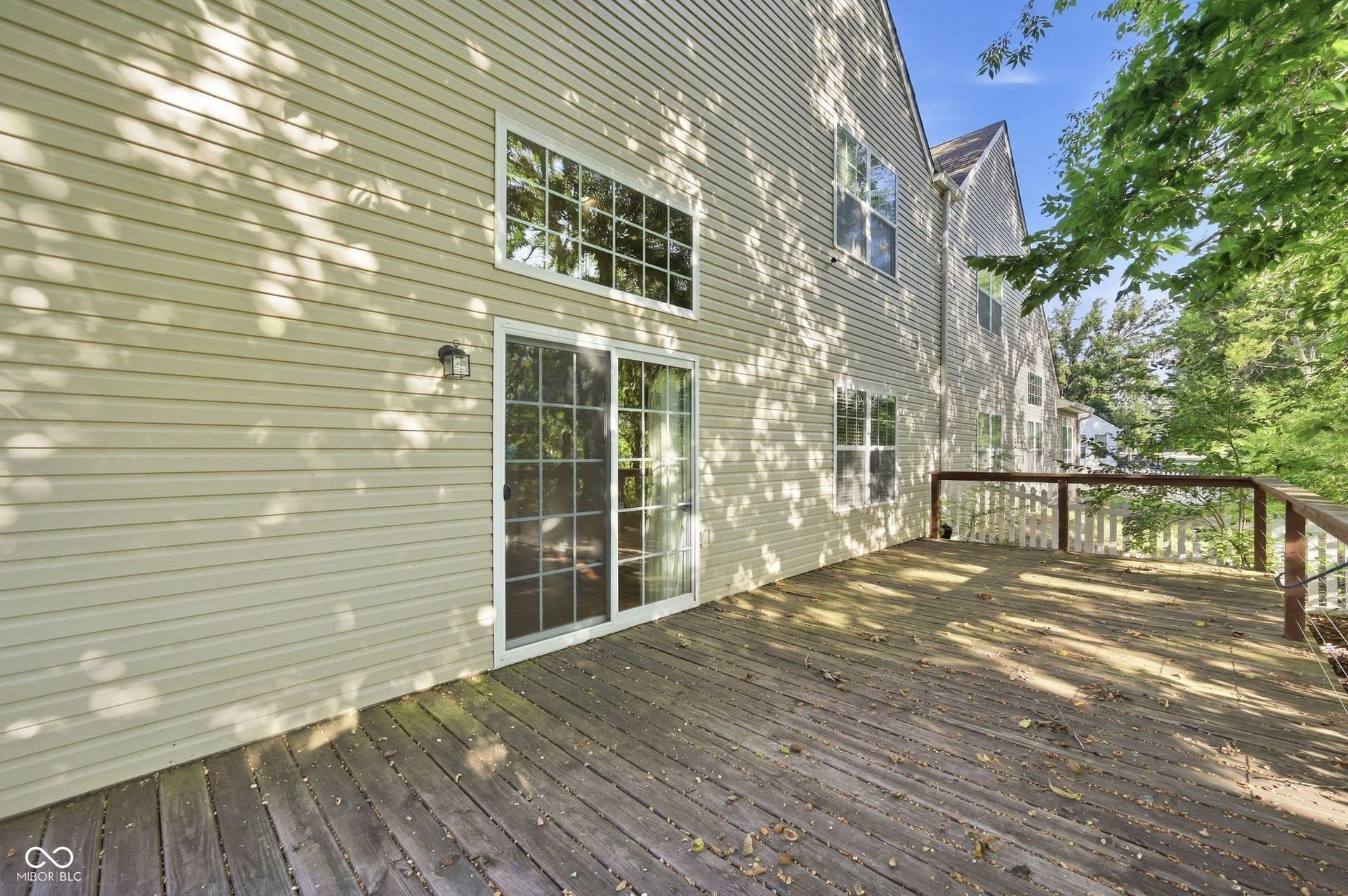 2743 Rylee Court, Greenwood, IN 46143 Expansive outdoor wood-finish deck with railing