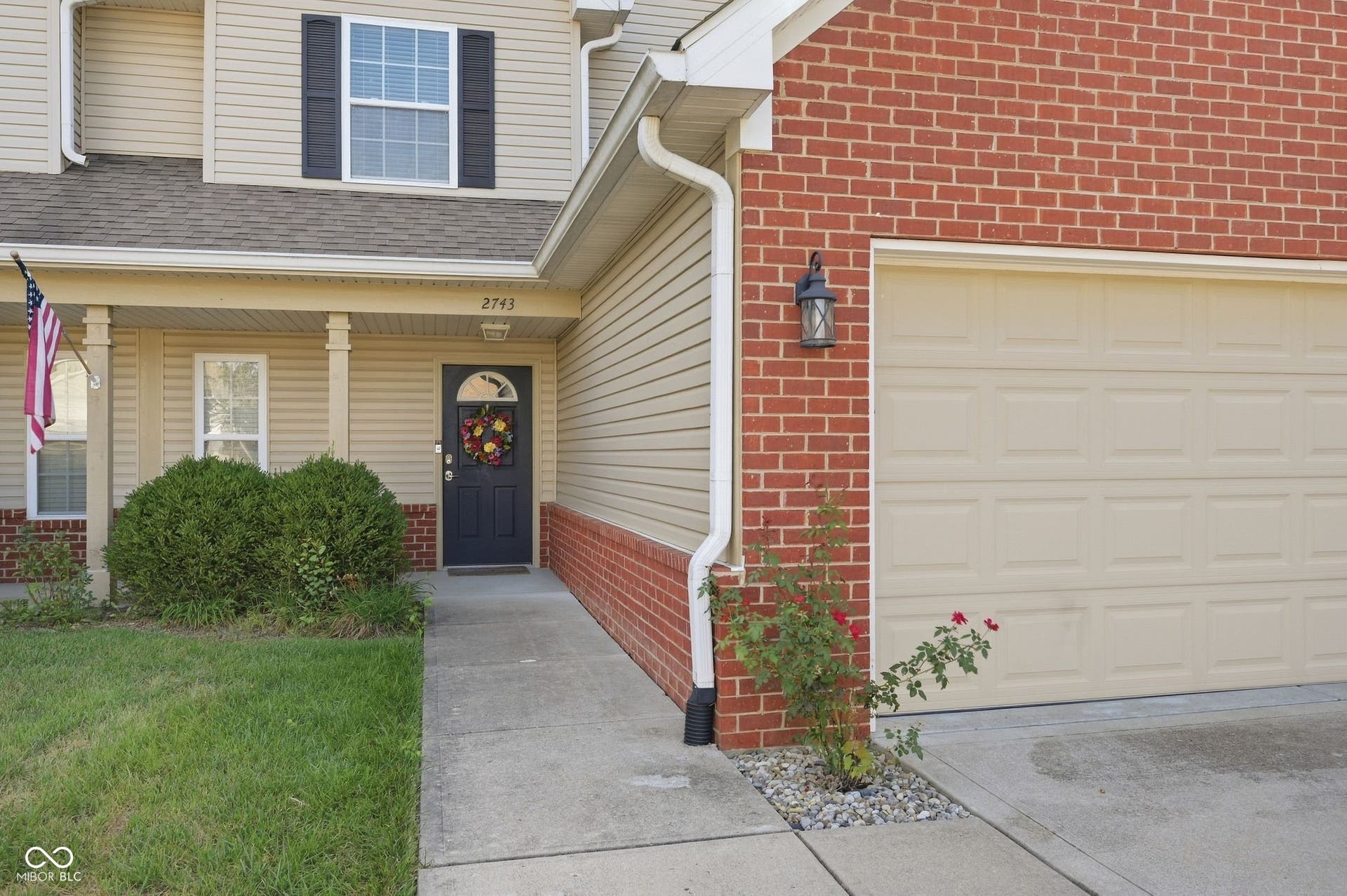 2743 Rylee Court, Greenwood, IN 46143 Siding exterior with brick accents, covered front porch