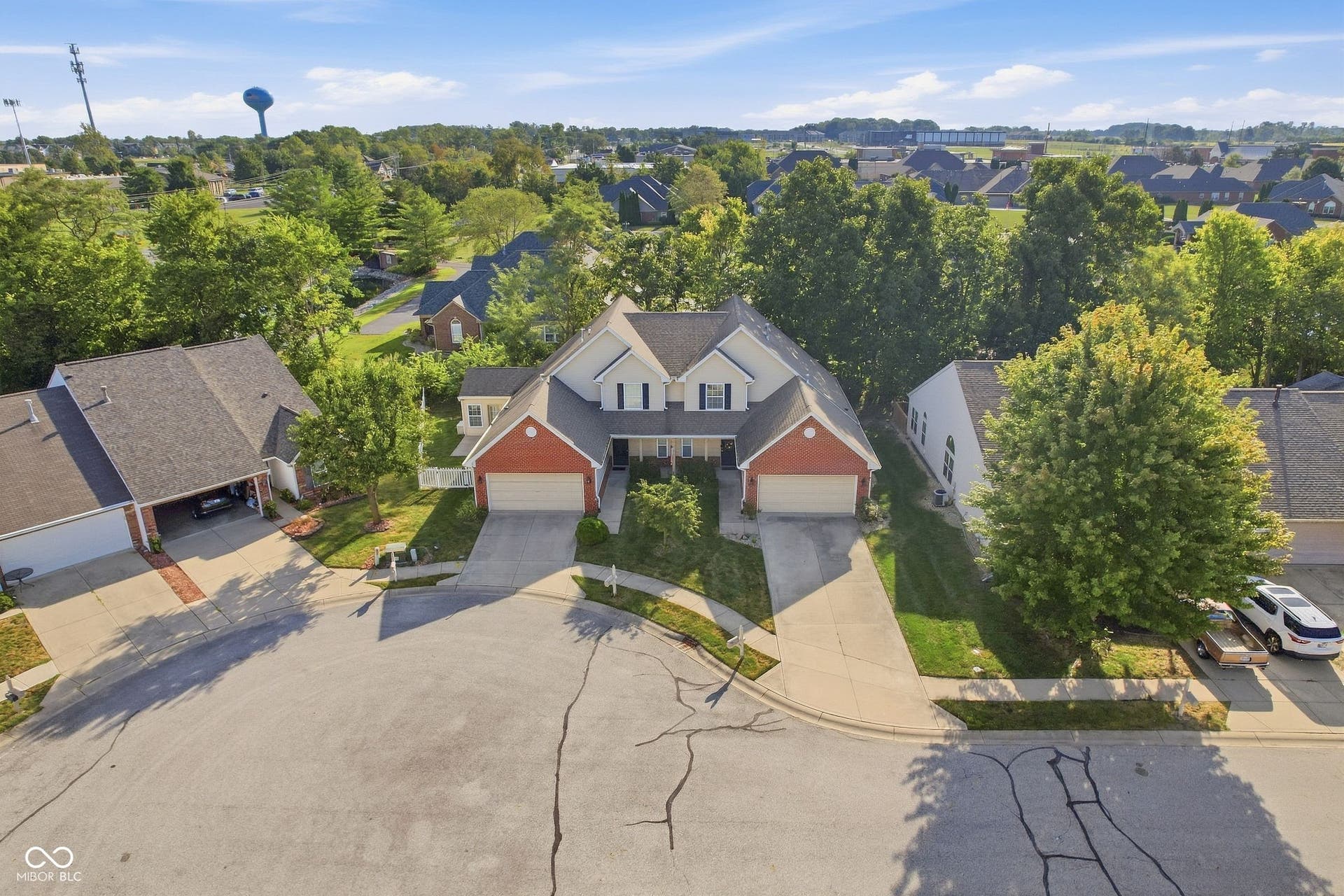 2743 Rylee Court, Greenwood, IN 46143 Attached two-car garages, and a paved driveway much bigger than others in the cul-de-sac.