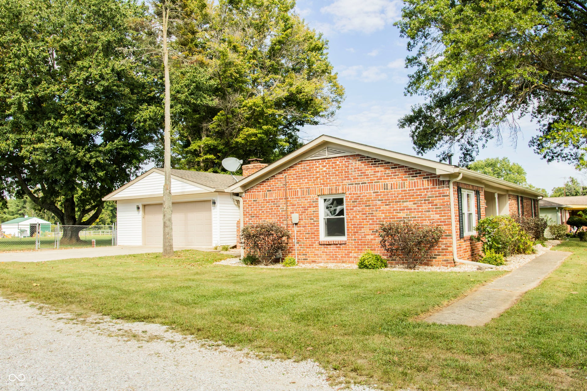 Brick exterior featuring a gabled roofline