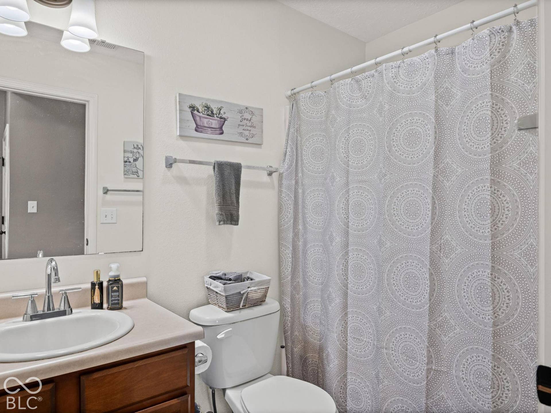 Second full bath has a shower/tub combo