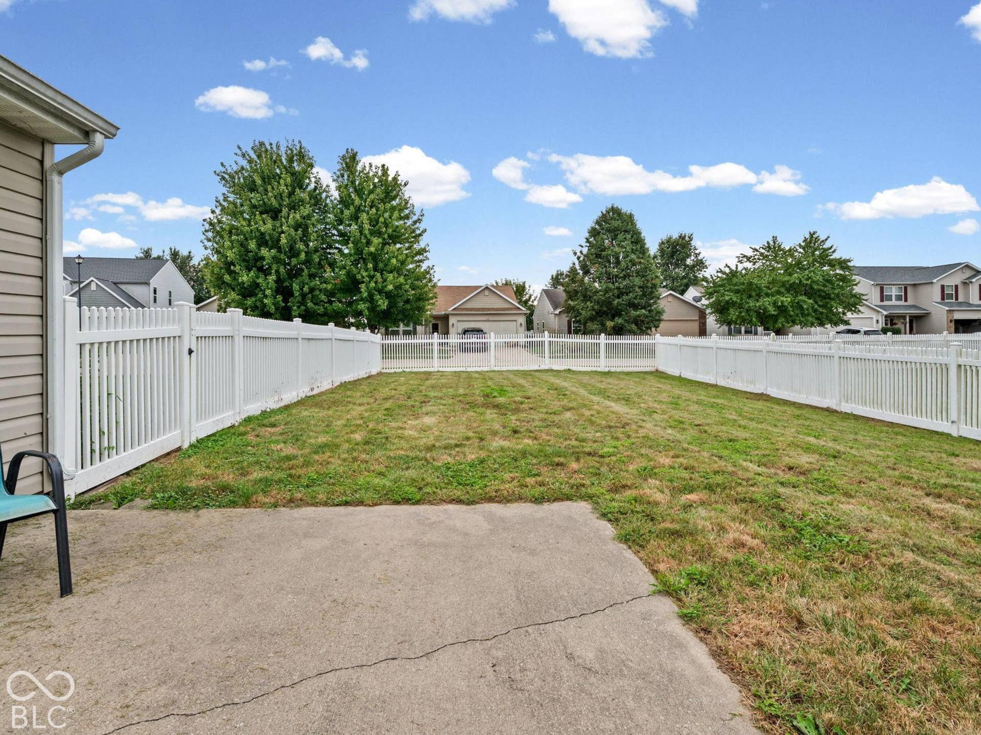 The backyard has a nice size patio and a large fenced in area
